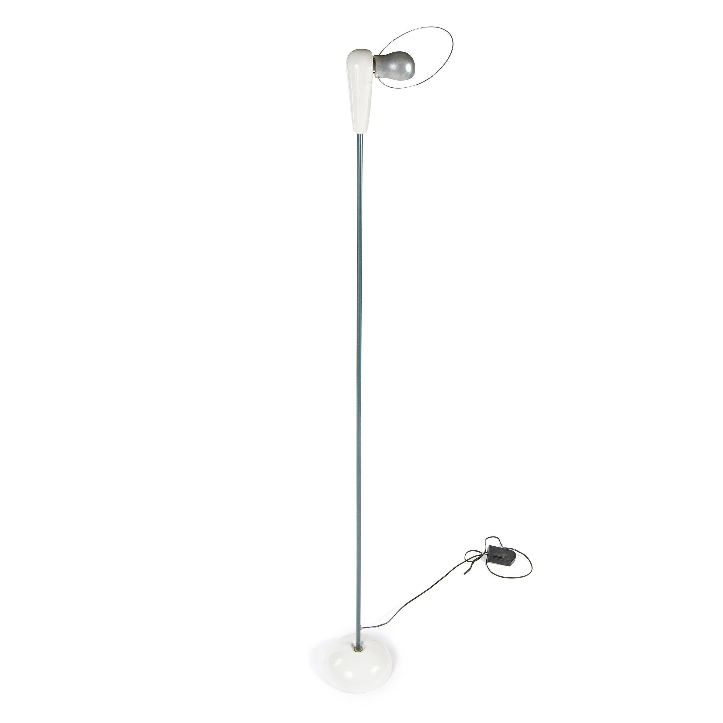 A minimal Italian floor lamp designed by Achille Castiglioni titled 'Bi Bip' with white ceramic half-dome base and head, a pivoting brushed metal shade and a wire halo. Made in Italy by Flos, circa 1970s.