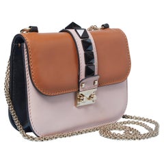 Bi-color leather bag with black studs VALENTINO GARAVANI
