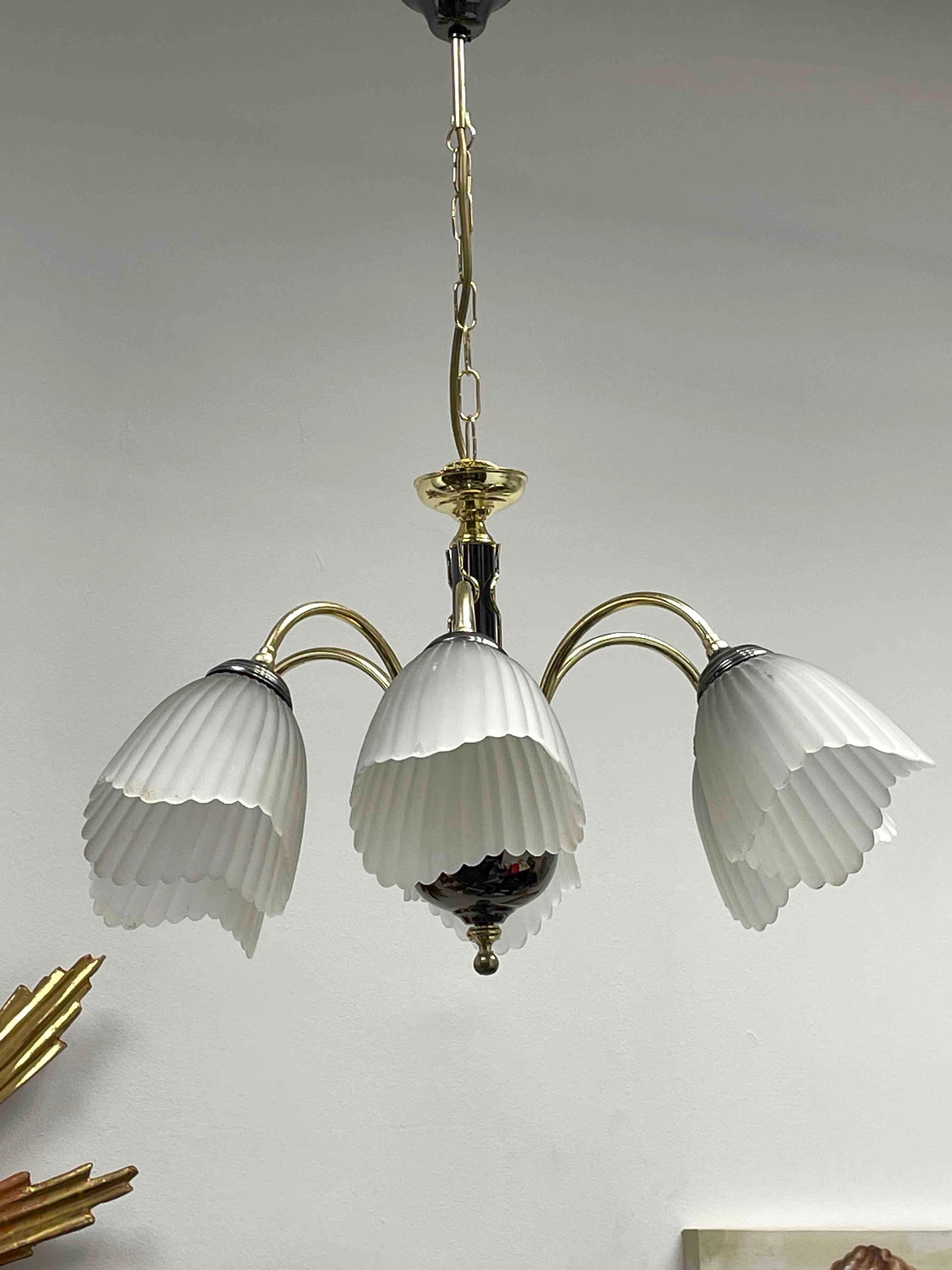 Beautiful chandelier or pendant light by Eglo Leuchten, Austria. An original vintage item manufactured in the 1980s. It is made of brass and black colored polished nickel. The Fixture requires six European E14 / 110 Volt Candelabra bulbs, each bulb