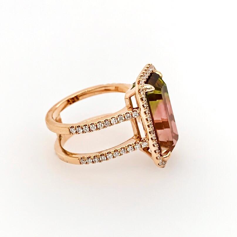 18K rose gold custom ring set with an emerald cut vibrant bi-color tourmaline weighing 7.02cts. It has a halo and double shank set with a total of 78 brilliant cut diamonds with a total weight of 0.88cts. The top measures 19mmx11.5mm. 