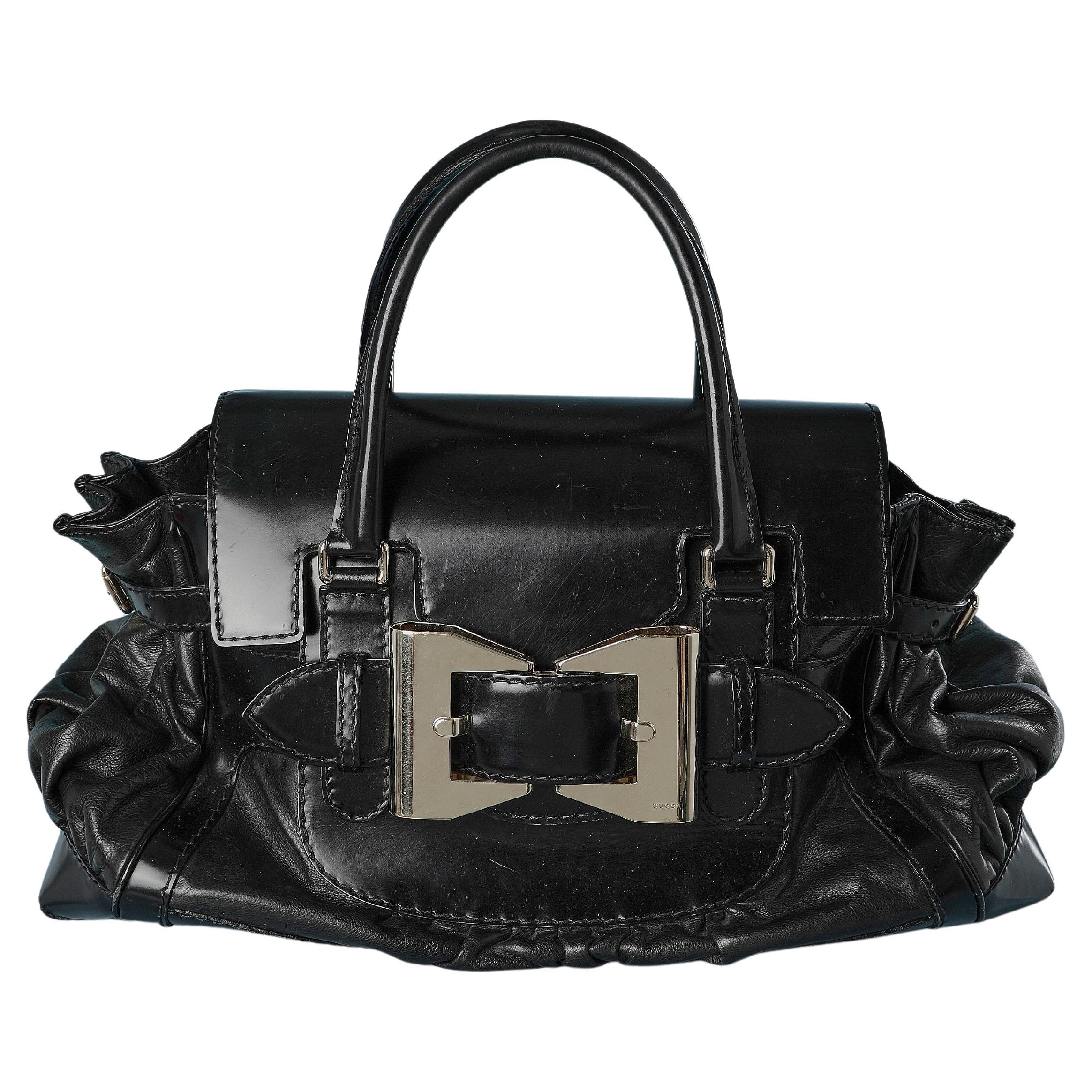 Bi-leather top handle bag with silver metal buckle on the front GUCCI For Sale