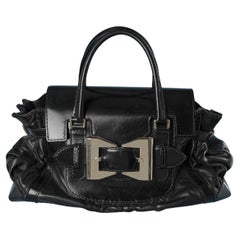Bi-leather top handle bag with silver metal buckle on the front GUCCI