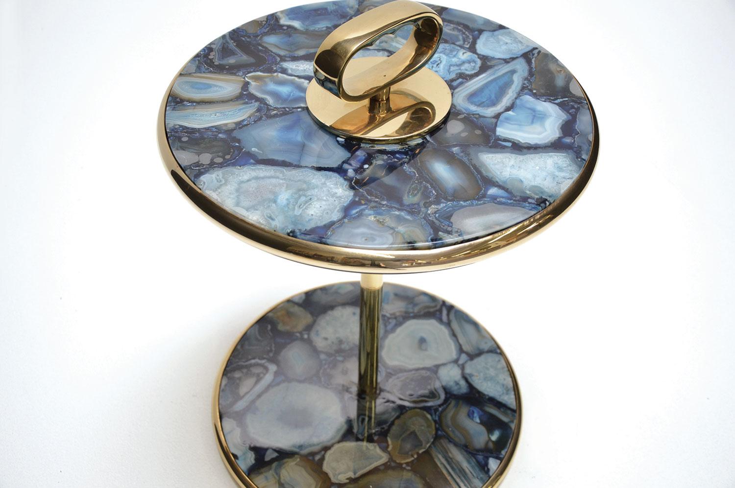 Cocktail side table constructed of polished brushed structure and blue agate stone plateau surfaces. The polished brass finish is uncoated. It can be coated to prevent natural tarnish and aging upon request.