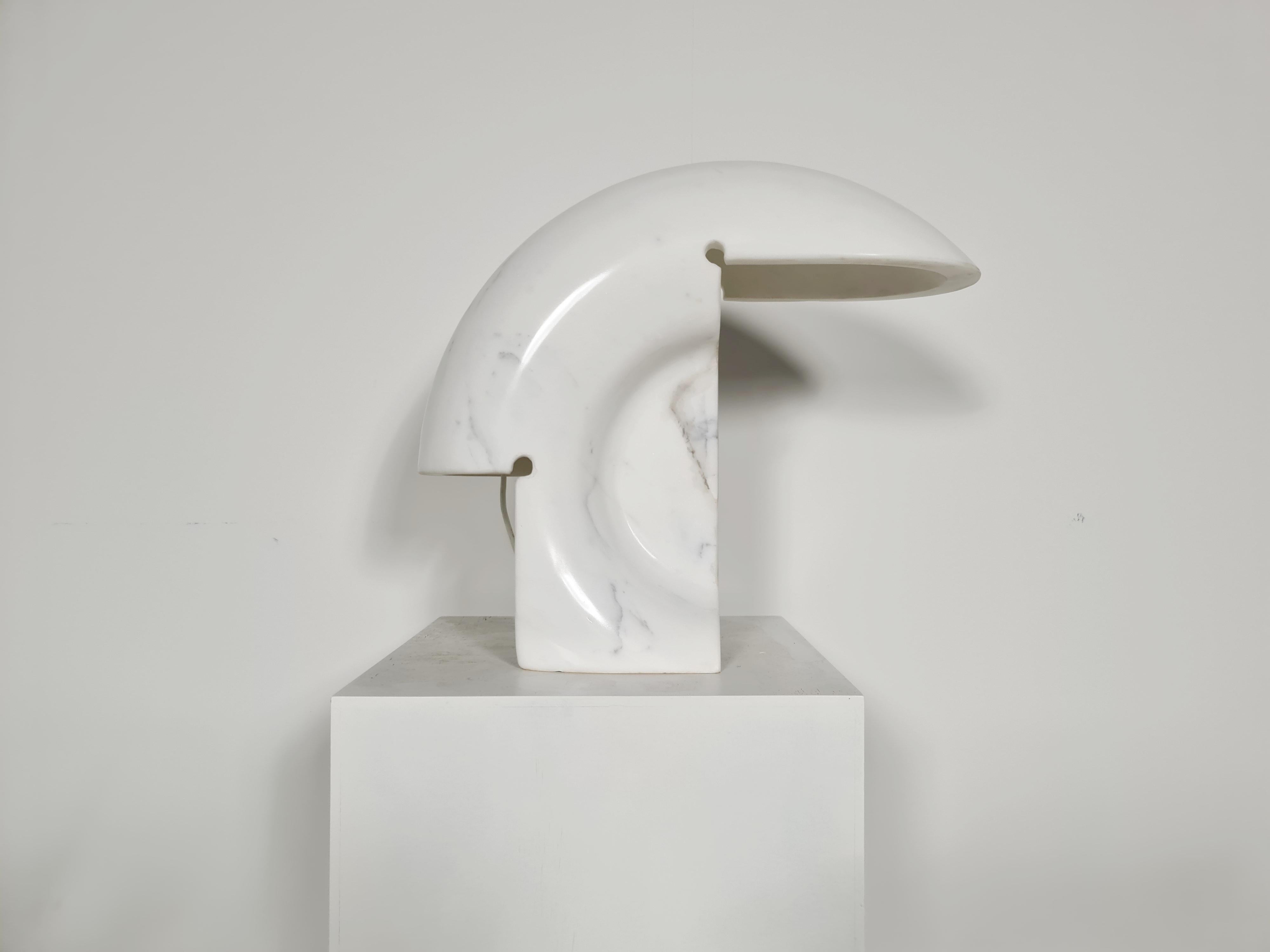The biagio lamp is one of Tobia Scarpa’s masterpieces. It has been cut and sculpted by hand from solid Carrara marble, resulting in an unique shaped design. The natural thickness of the marble ensures that when lighted, the lamp spreads a pleasing