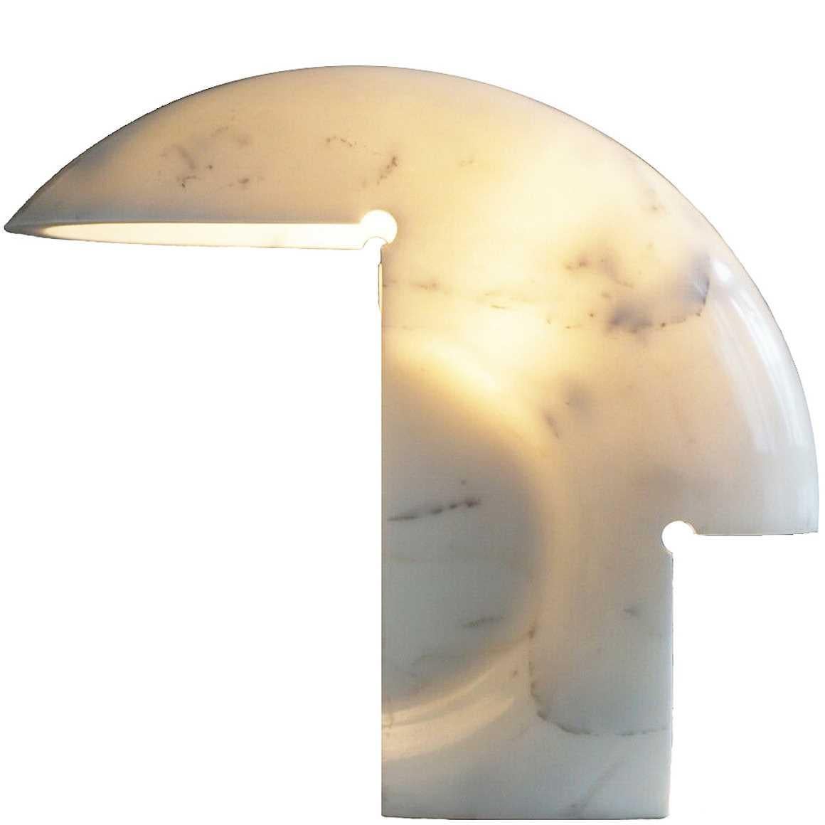 Designed by Tobia Scarpa in 1968.

Table lamp providing direct light. Lamp body carved seamlessly from a single block of Carrara marble. Elegant and unique, this light is a sculpture unto itself that will add personality to any room.