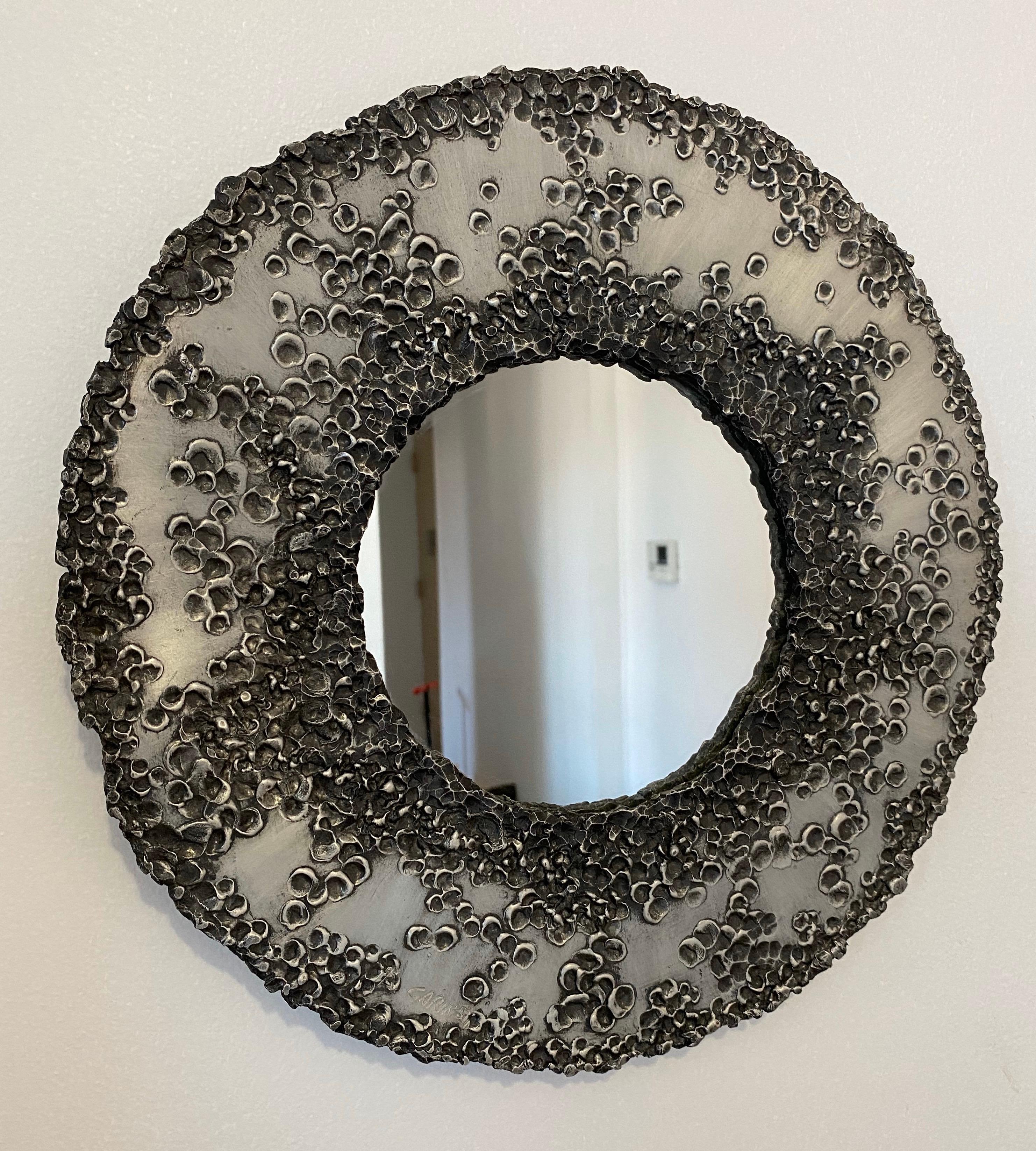 A handcrafted sculptural steel mirror done in the brutal style by Italian artist, Bianca Garinei for Banci Florence. Signed.

  