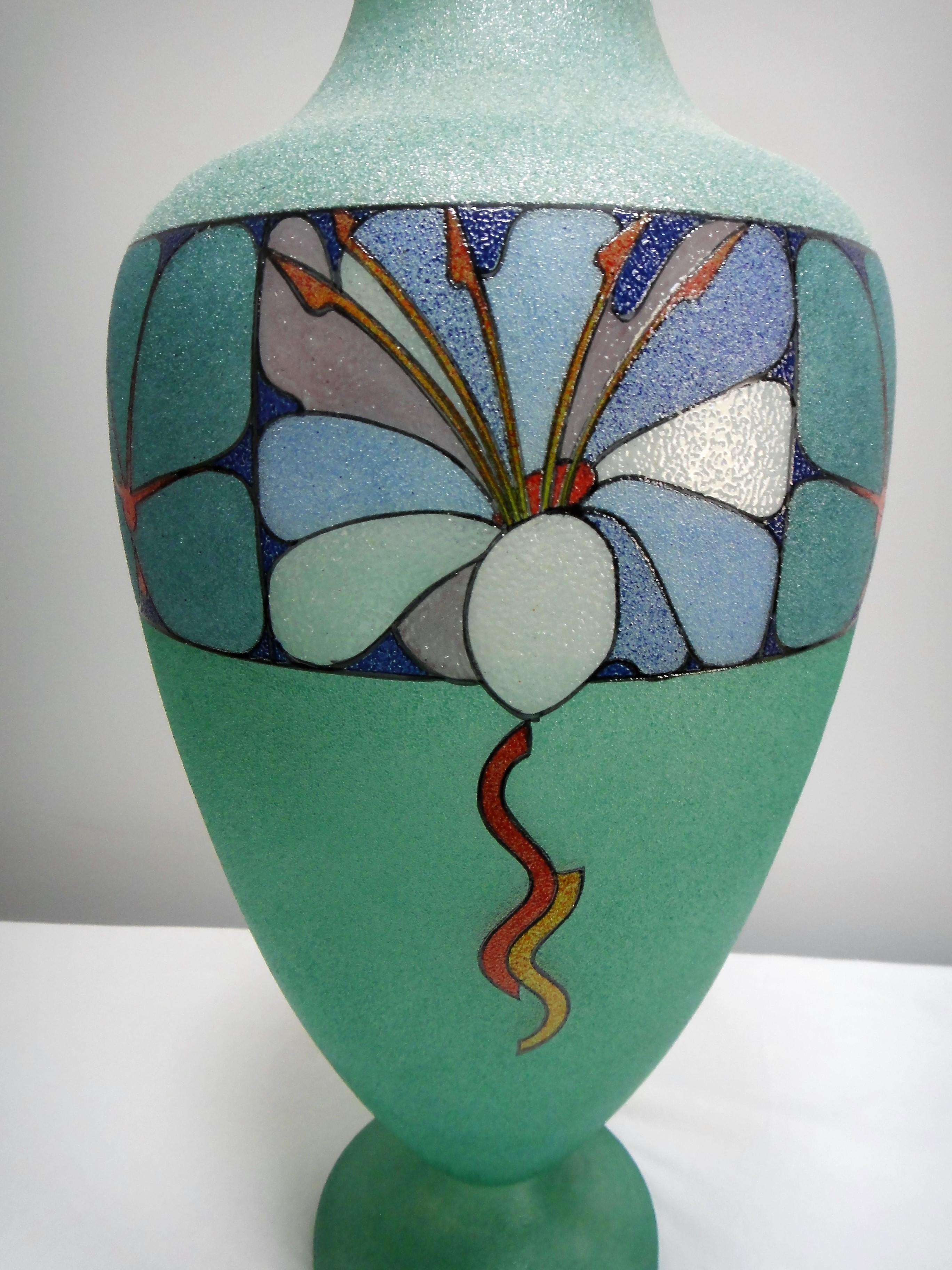 Offered for sale is a large Biancalani Elio handblown and decorated art glass vase with a graniglia glass grit finish. The vase has a floral motif and is created in the Art Deco style.