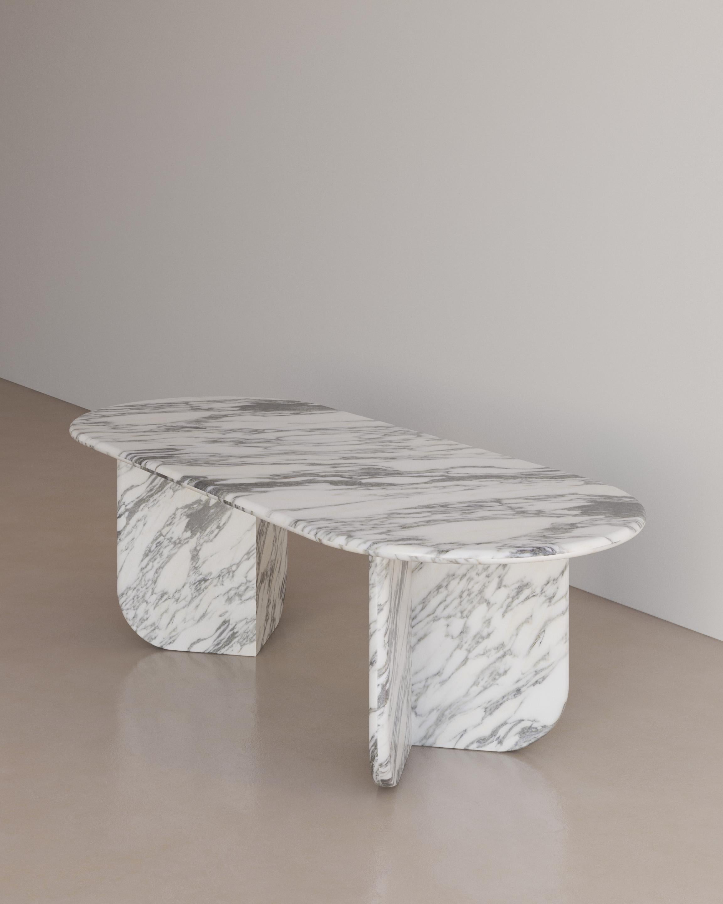 The Essentialist presents the Ètoile Dining Table I in Bianco Arabescato Marble. A bold rounded circle effortlessly stacks upon a four point star. Smooth planes exonerate beautiful natural patterning, forging a statement of minimalism that embodies