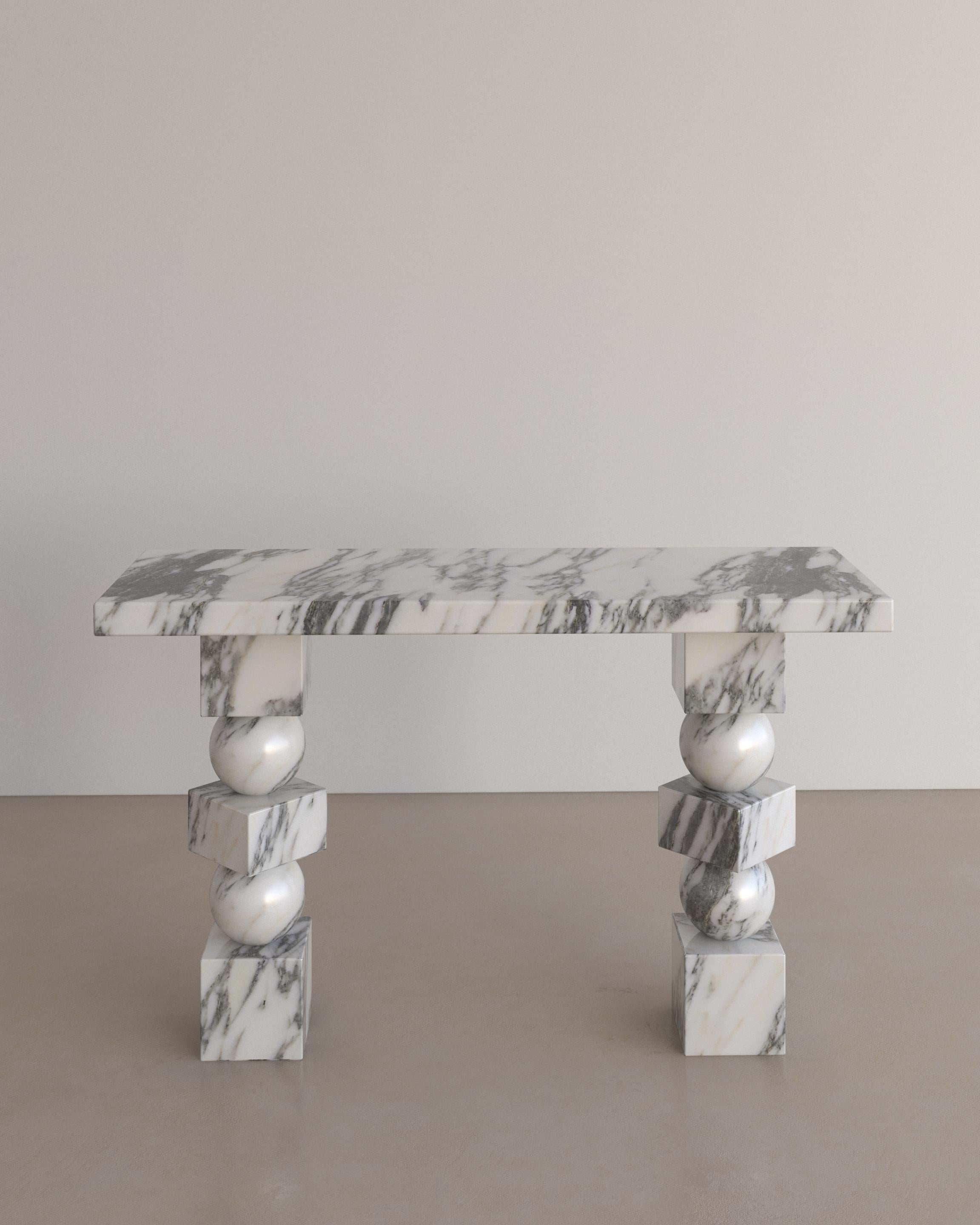 The Sufi Console Table in Bianco Arabescato Marble by The Essentialist celebrates proportion, scale and ancestral power. Three simple geometric shapes, stacked in a sequence bursts with undeniable energy, courtesy of the natural stone they are