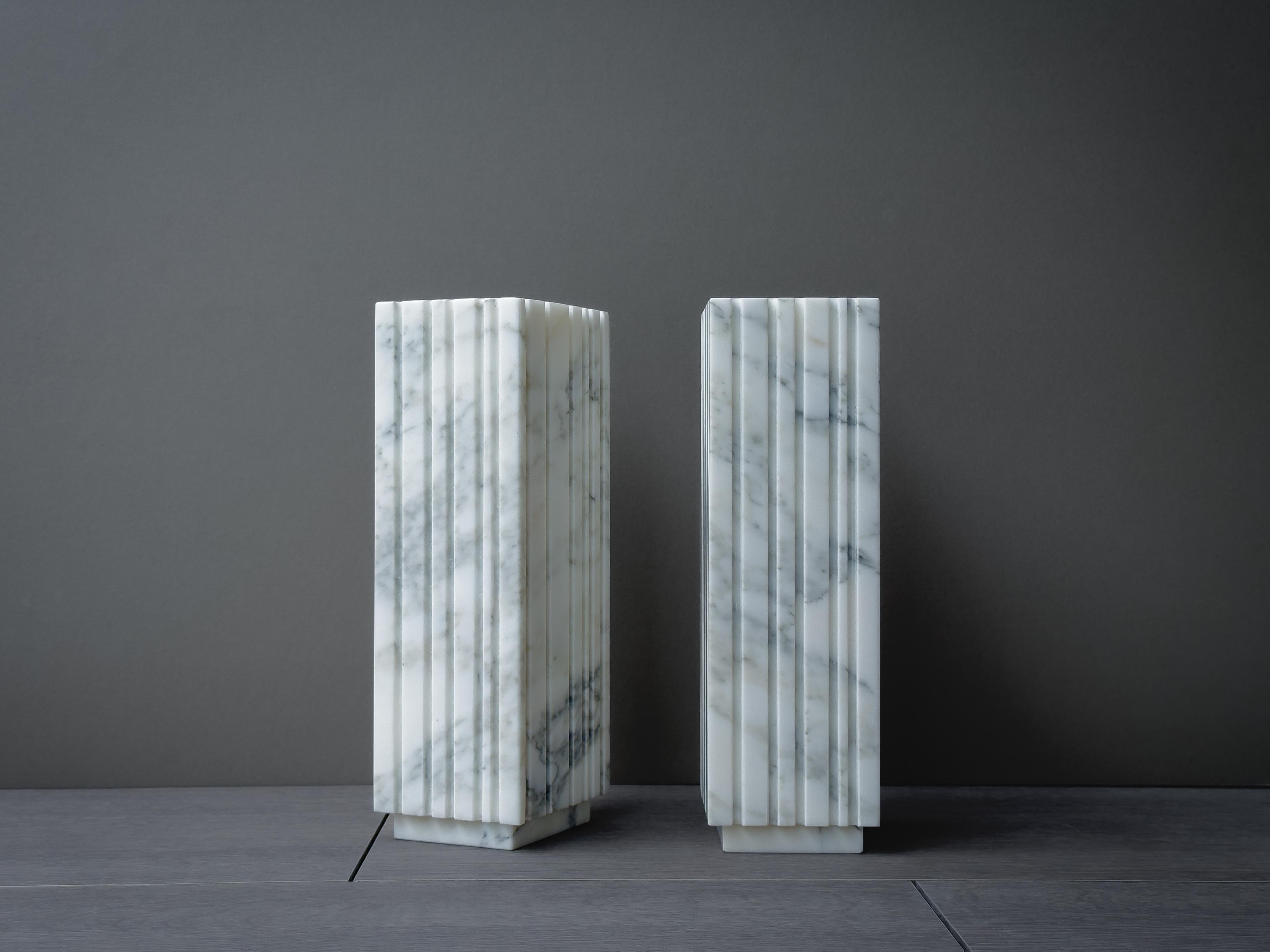 The Bianco Groovy vase is a rectilinear block fused with lines and shadow to create a timeless and elegant object. Made from Arabescato marble.

 
*Actual product may differ from photographs as marble is a natural material.
*Marbles, granite and all