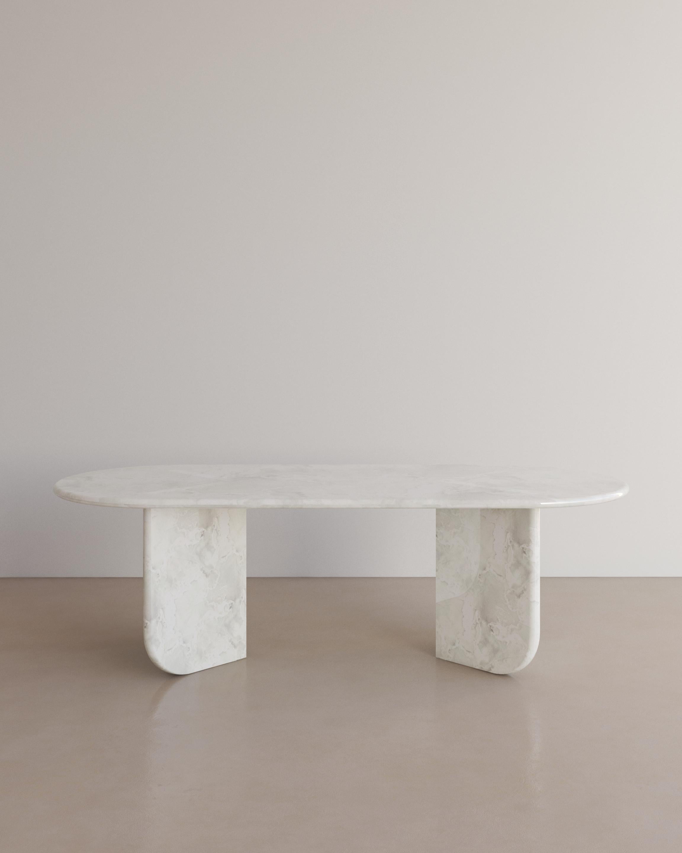 The Essentialist presents the Ètoile Dining Table I in Bianco Onyx. A bold rounded circle effortlessly stacks upon a four point star. Smooth planes exonerate beautiful natural patterning, forging a statement of minimalism that embodies the spirit of