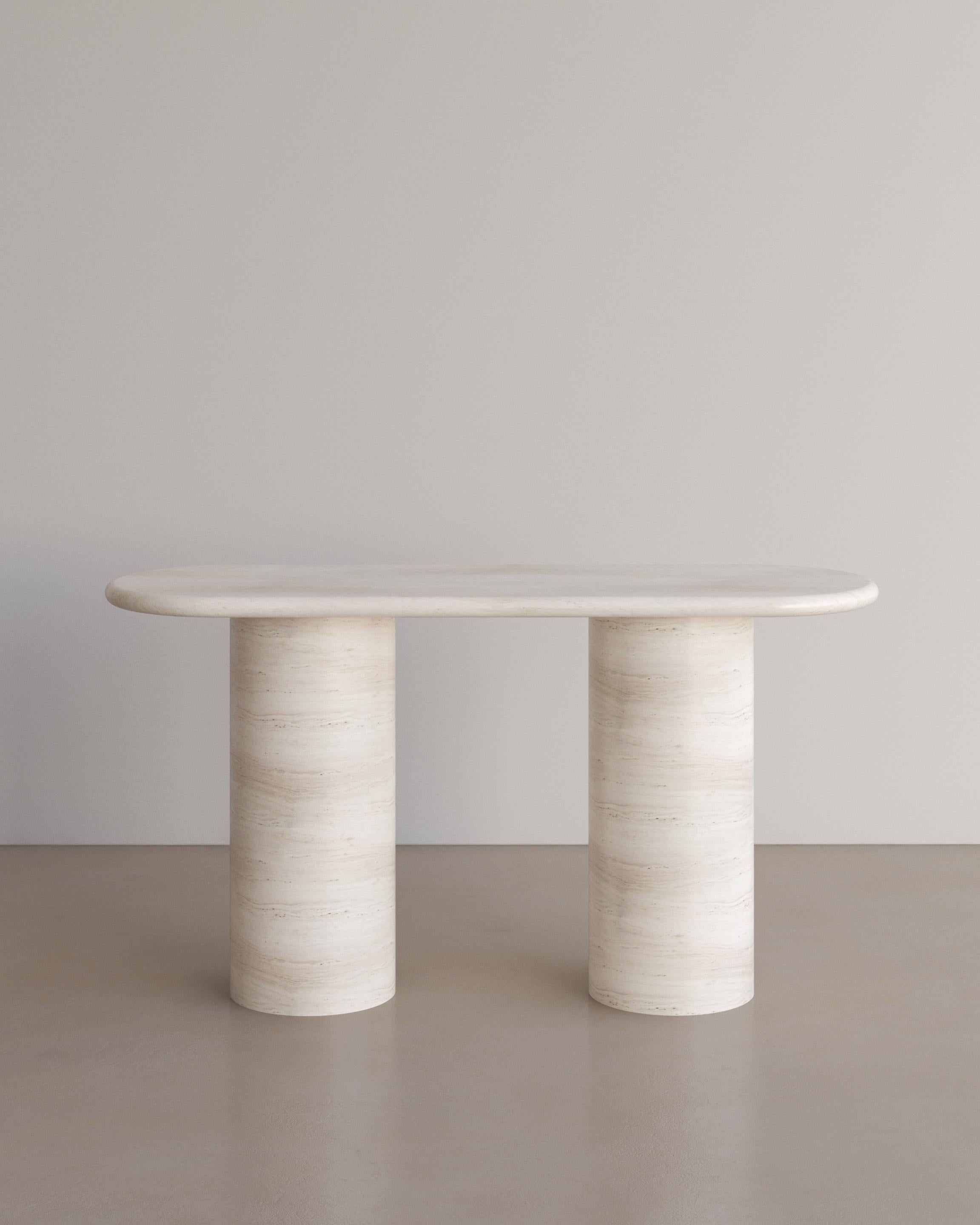 The Voyage Console table in Bianco Travertine by The Essentialist defines life’s simple pleasures in its essential form. Soft planes resting on smooth pillars reflect nature’s aesthetic balance and perfect harmony.

Igniting a dance between