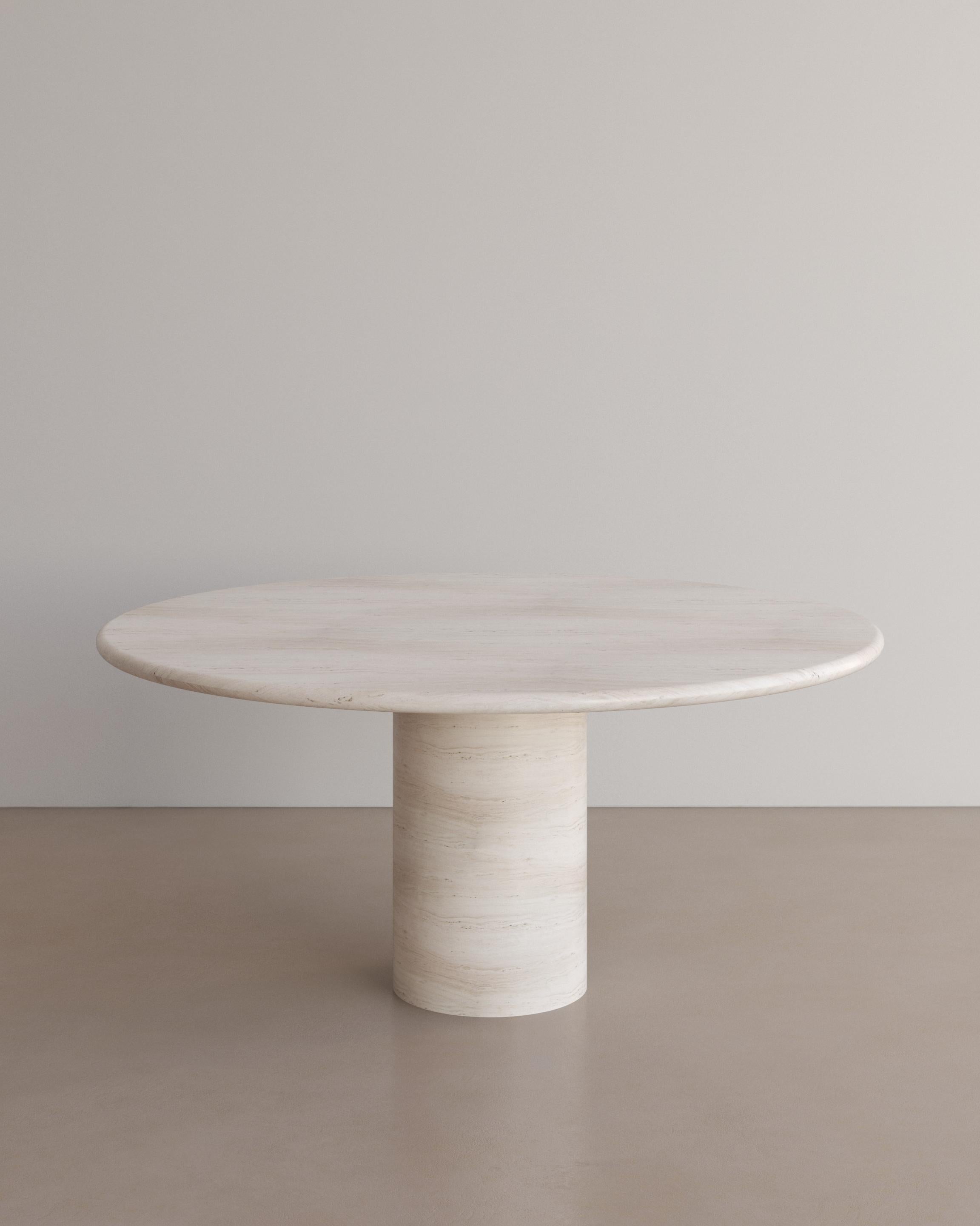 The Voyage Dining Table I in Bianco Travertine by The Essentialist celebrates the simple pleasures that define life and replenish the soul through harnessing essential form. Envisioned as an ode to historical elegance, captured through a modern lens