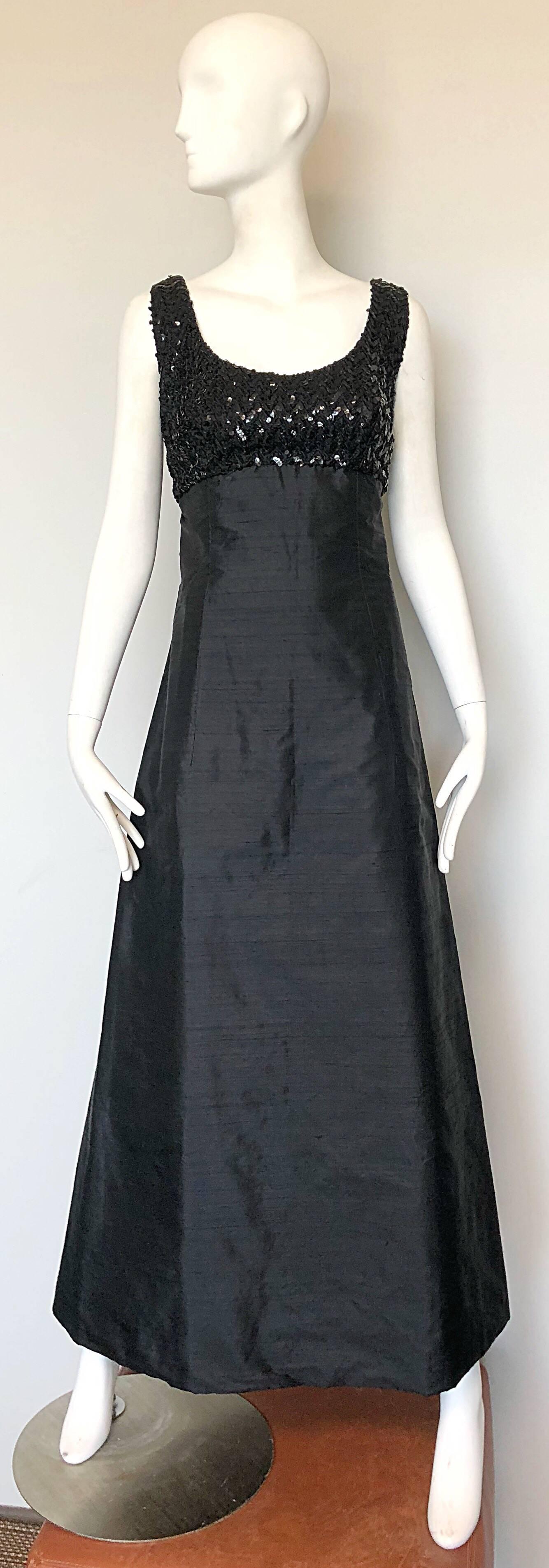 Stunning 1960s BIBA black silk shantung bell shaped full length sleeveless evening dress! Features hundreds of hand sewn black sequins on the fitted bodice. Raw silk shantung body with a flared hem. Full metal zipper up the back with hook-and-eye