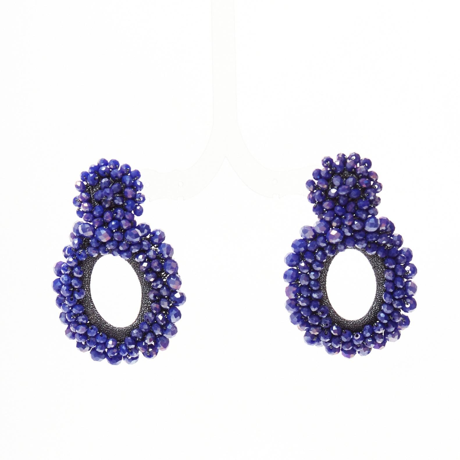 BIBI MARINI blue purple beaded lurex fabric hoop loop through earrings
Reference: AAWC/A01252
Brand: Bibi Marini
Material: Fabric
Color: Blue, Silver
Pattern: Solid
Closure: Loop Through
Lining: Silver Metal

CONDITION:
Condition: Excellent, this