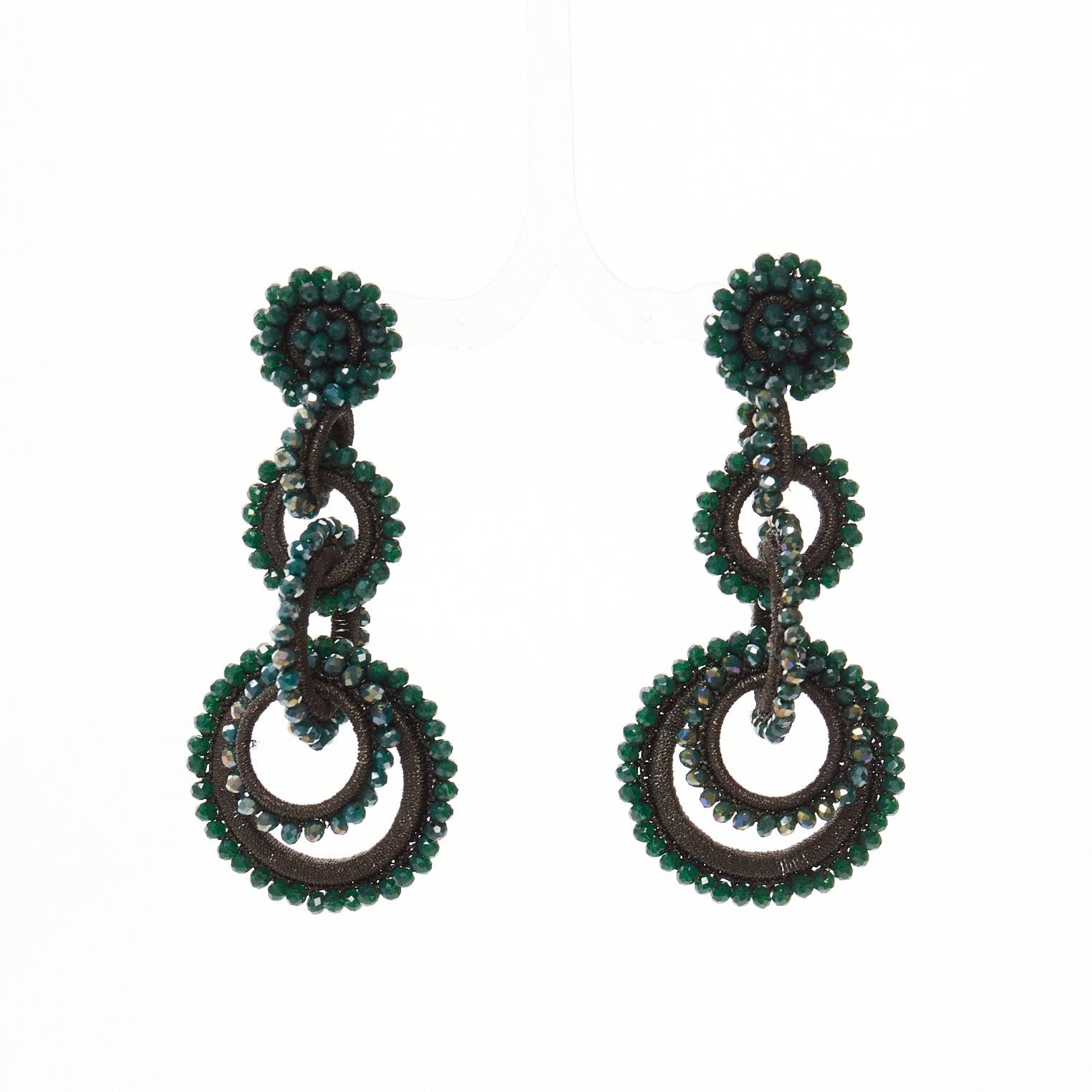 BIBI MARINI moss green beaded fabric multi hoop loop through earrings
Reference: AAWC/A01253
Brand: Bibi Marini
Material: Fabric
Color: Green, Black
Pattern: Solid
Closure: Loop Through
Lining: Silver Metal

CONDITION:
Condition: Very good, this