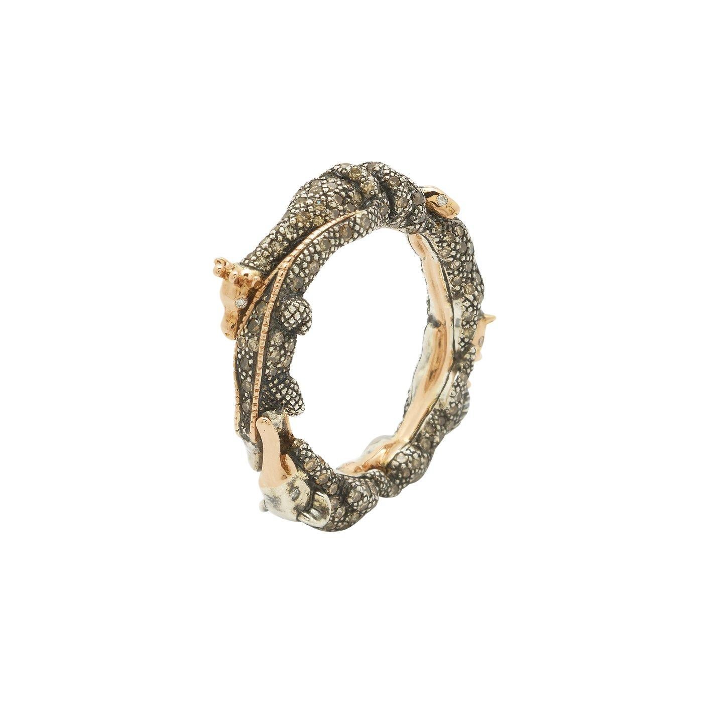 An elegant circle of life, the Animal Eternity Ring is fashioned as an intertwined knot of animals, among them a snake, a lion, and a ram. Designed in 18k recycled rose gold and sterling silver, these finely crafted animals have twinkling white
