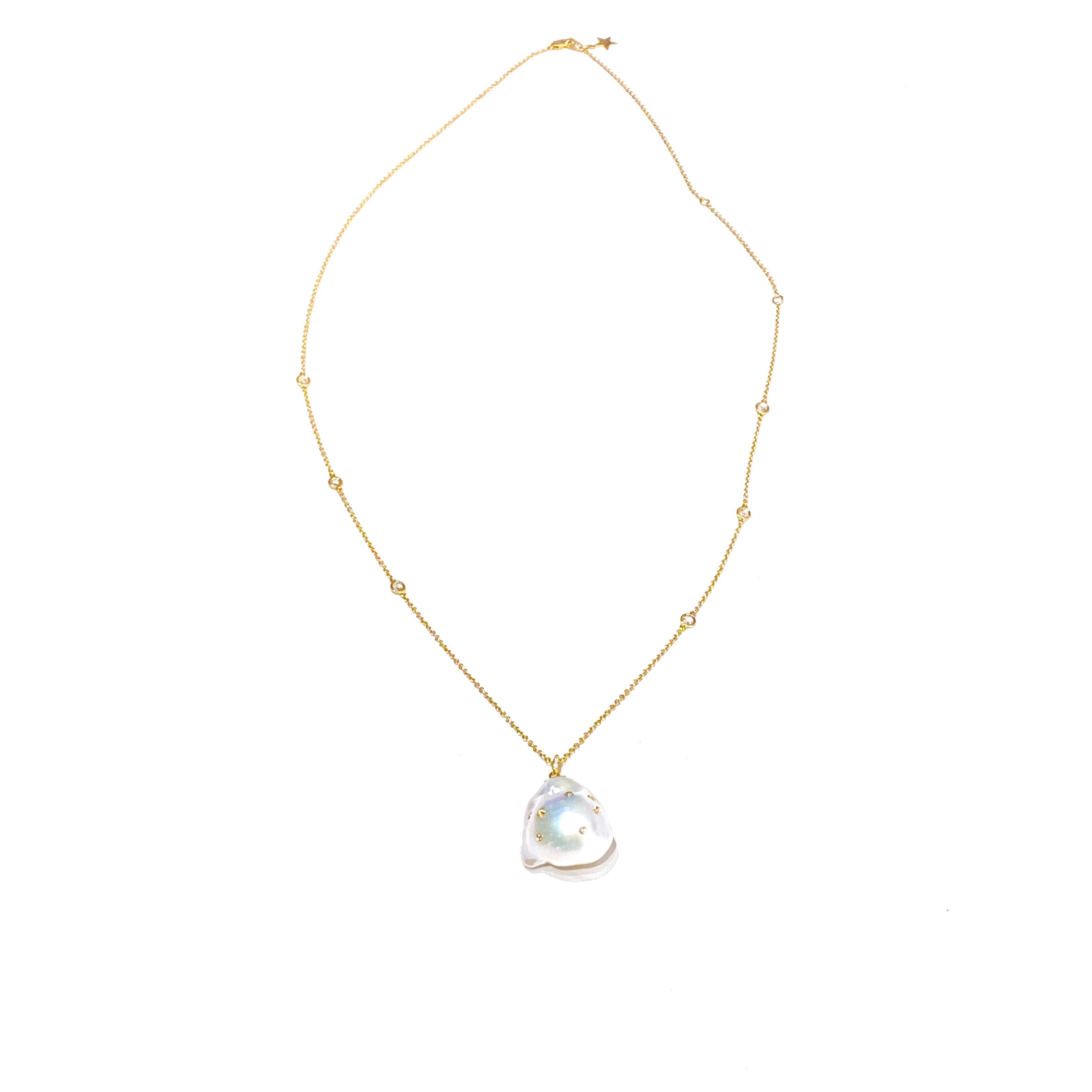 Inspired by the beauty of imperfection, Bibi van der Velden sculpts exotic materials into one-of-a-kind jewelry evoking her respect for our natural world.

This necklace features a stunning baroque pearl with a white, rose-cut diamond pendant and a