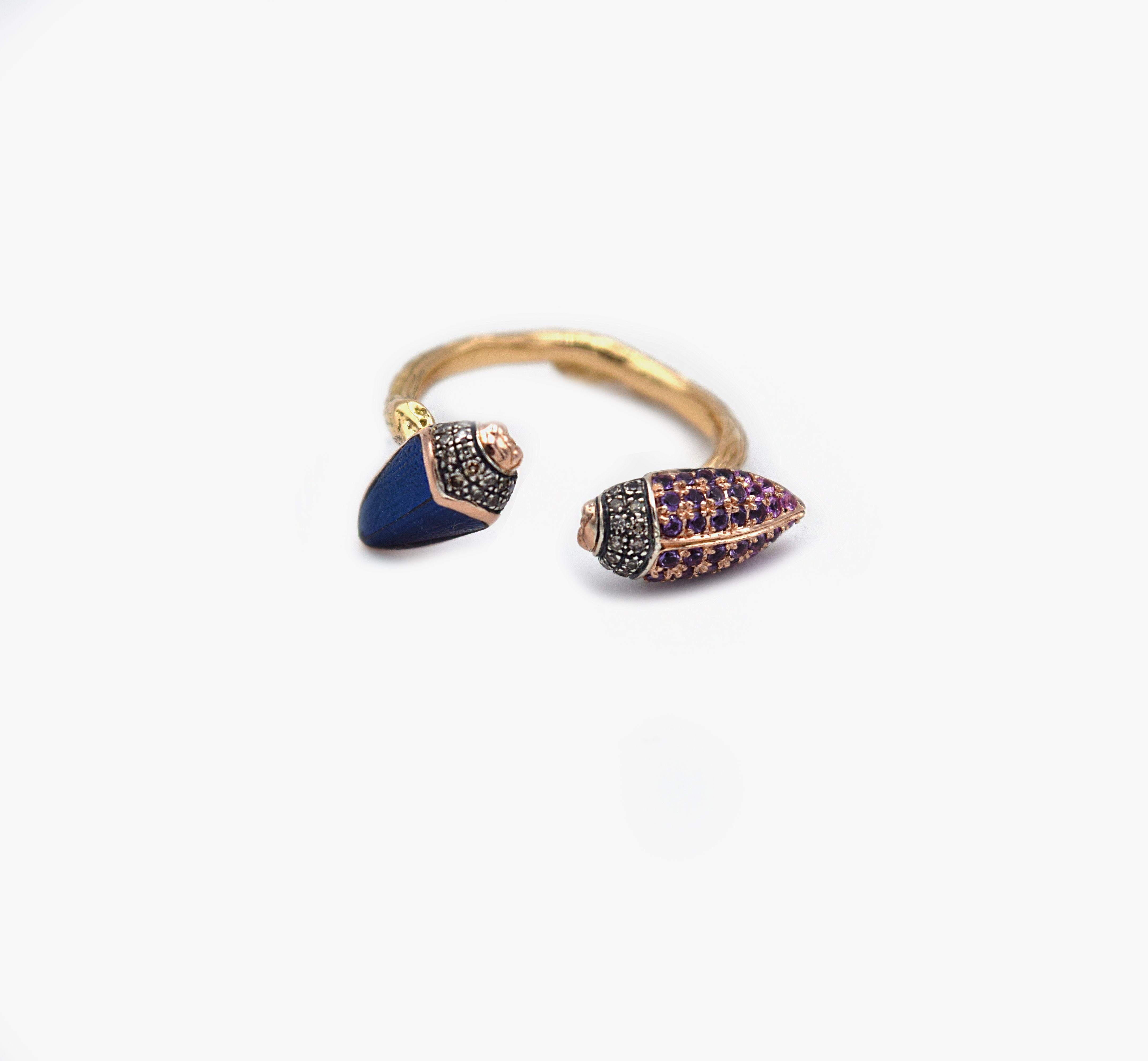 Inspired by the beauty of imperfection, Bibi van der Velden sculpts exotic materials into one of a kind jewelry evoking her respect for our natural world.

This ring features a unique design of floaty scarabs encrusted with real scarab wings, pink
