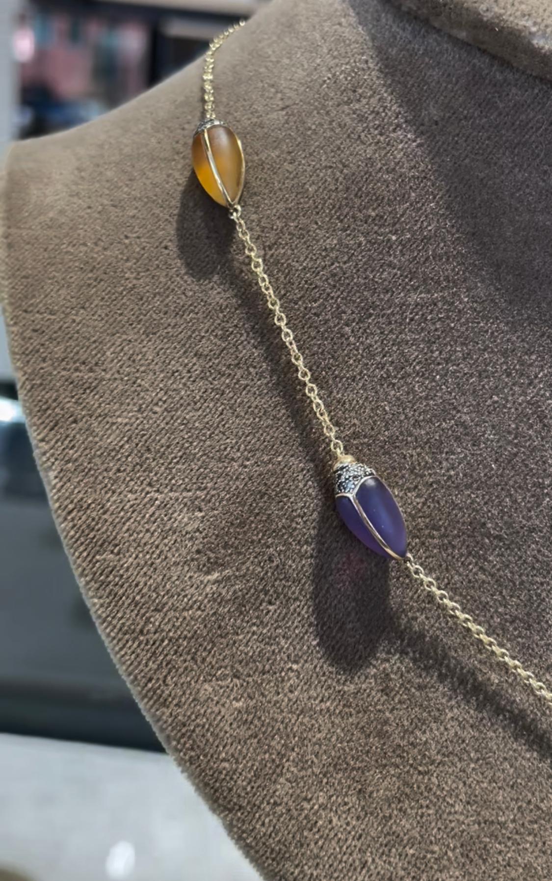 Inspired by the beauty of imperfection, Bibi van der Velden sculpts exotic materials into one of a kind jewelry evoking her respect for our natural world.

This necklace features a unique design with five scarabs with real scarab wings, diamonds,