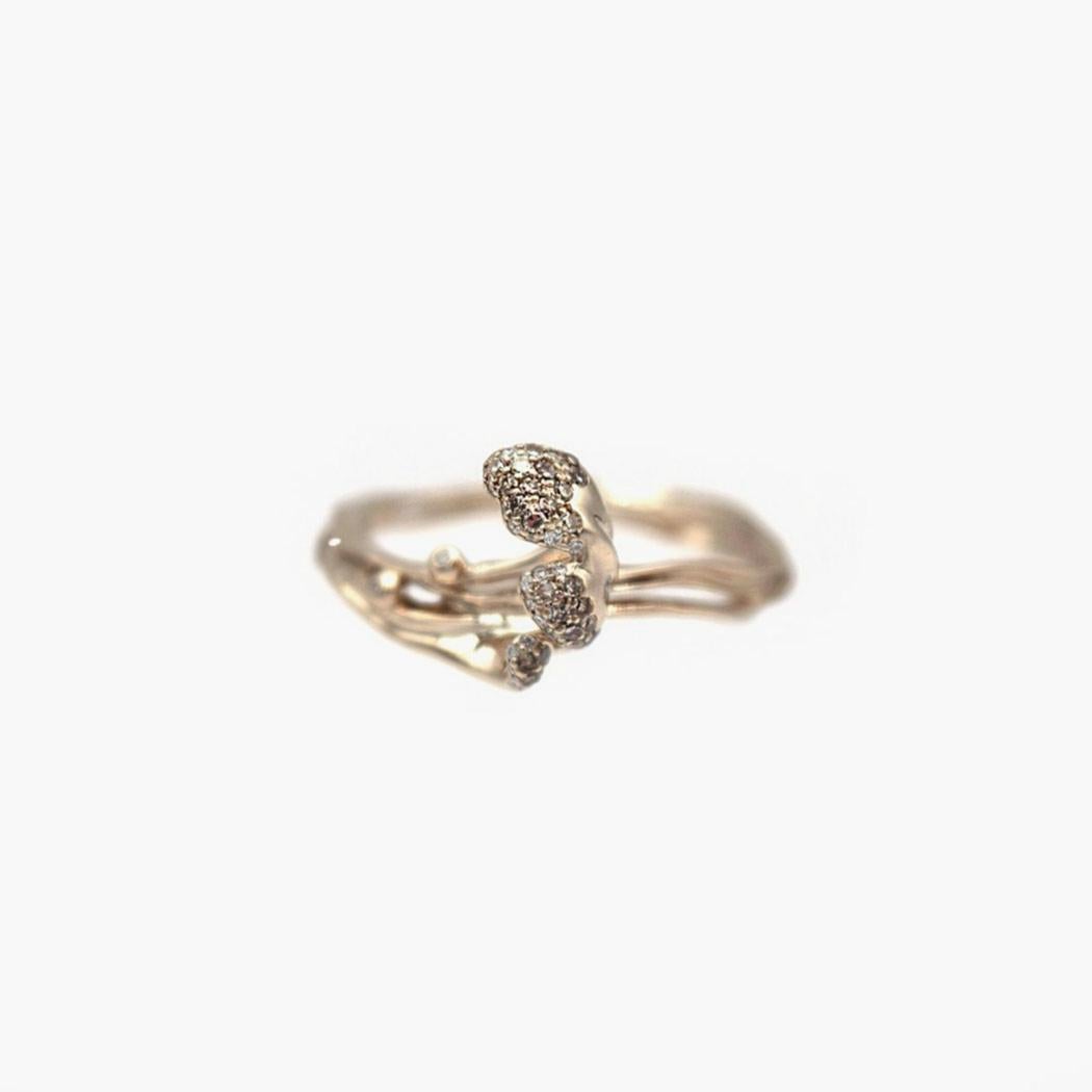 The Wave Stackable Rings are three rings that can nestle together to be worn as one piece, or can be purchased and worn as single rings. Designed in 18k pure white gold, which has a slightly yellow tone, the rings are set with light brown and white