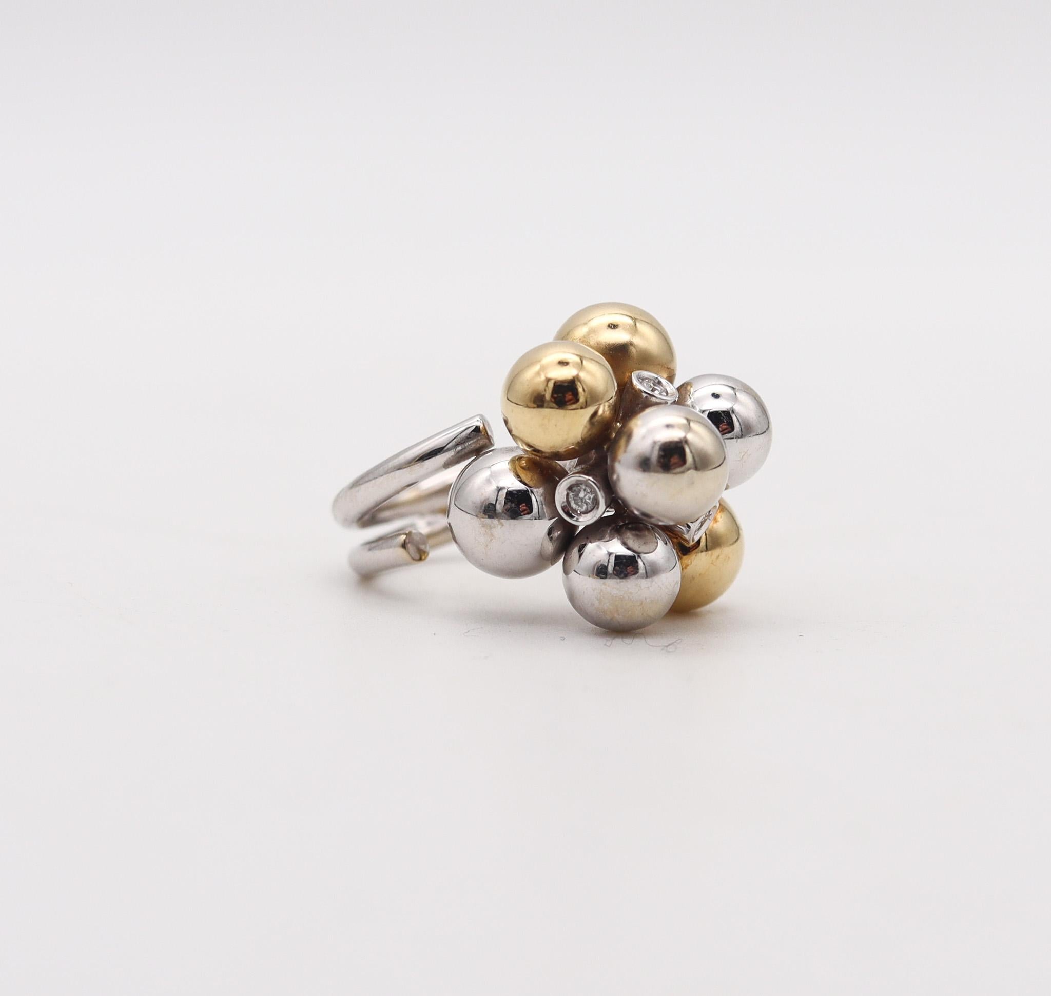 Cocktail ring designed by Bibigi Gioielli.

Beautiful bubbles cocktail ring, created in the city of Arezzo Italy at the jewelry atelier of Bibigi Gioielli. This modernist ring has been crafted in solid white and yellow gold of 18 karats with high
