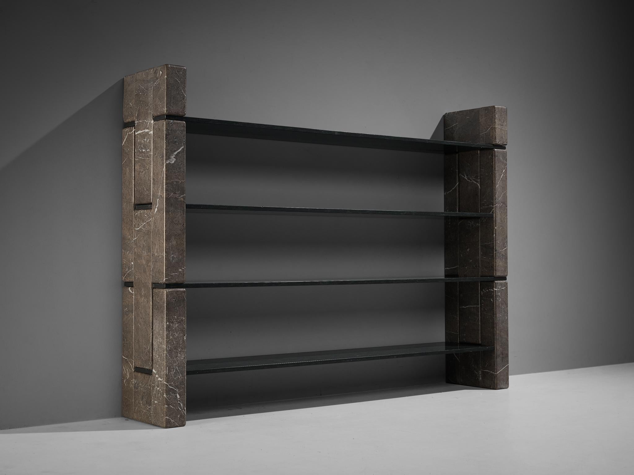 Renato Polidori for Skipper, 'Biblos' bookcase, two types of marble, Italy, 1976.

Postmodern cabinet in marble, designed by the Italian Renato Polidori in 1976. The bookcase consists of four green marble shelves, held in place by large and heavy