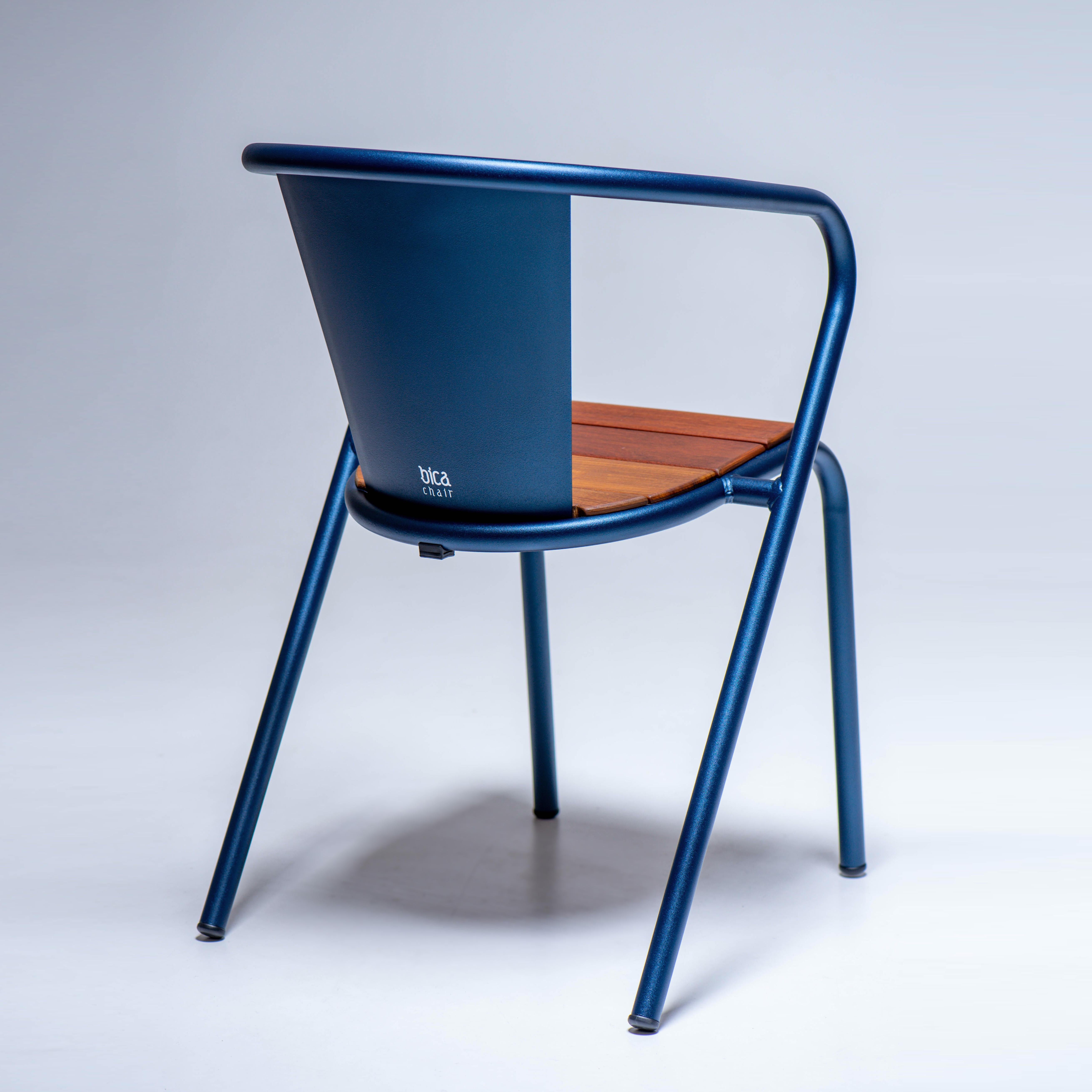 BICAchair is a sustainable stackable steel armchair made for the outdoors from recycled and recyclable steel and finished with our premium selection of powder-coating colors, in this case in a texturized Deep Blue color, that transforms a Classic in