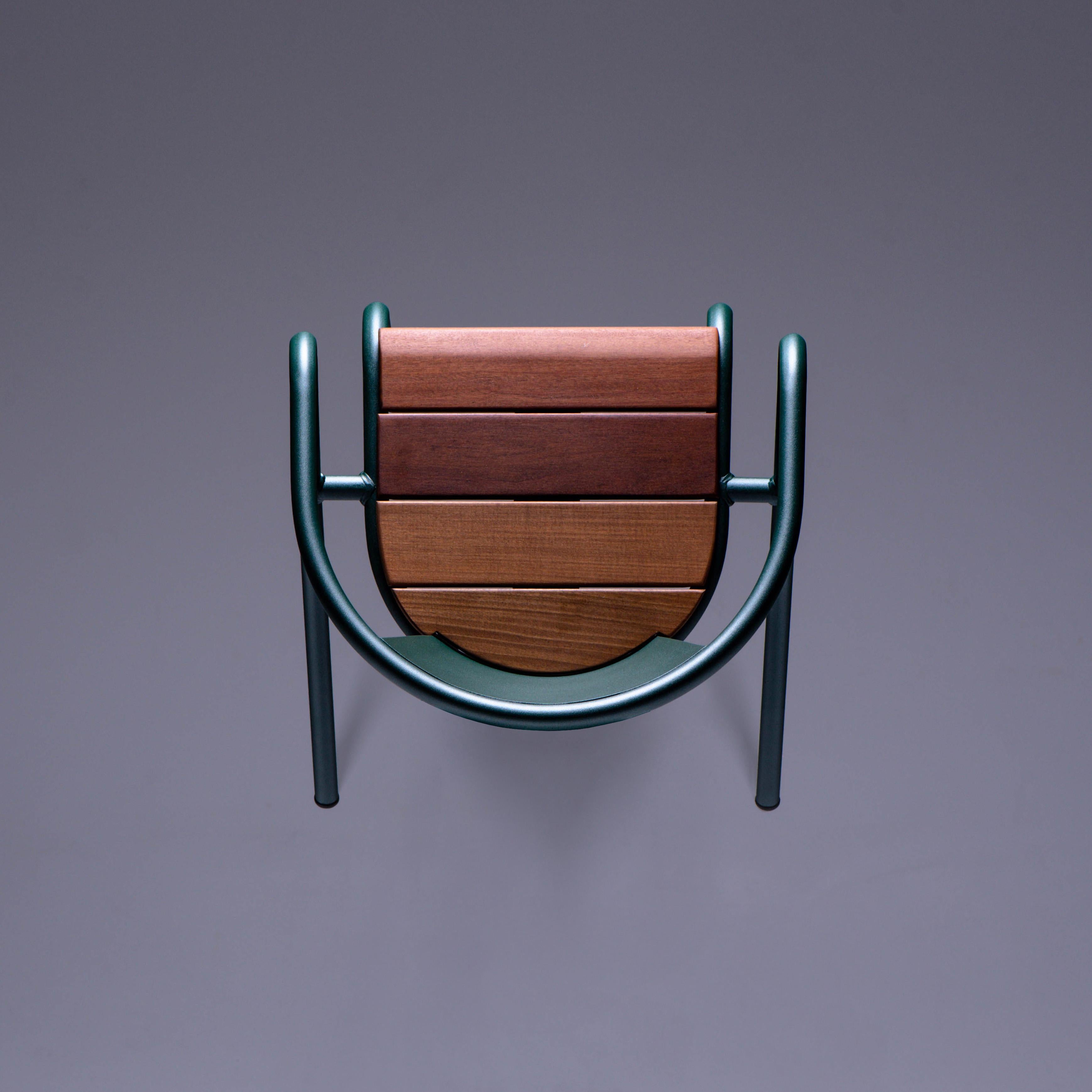 BICA chair is a sustainable stackable steel armchair made for the outdoors from recycled and recyclable steel and finished with our premium selection of powder-coating colors, in this case in a rich dark Green color, that transforms a Classic in
