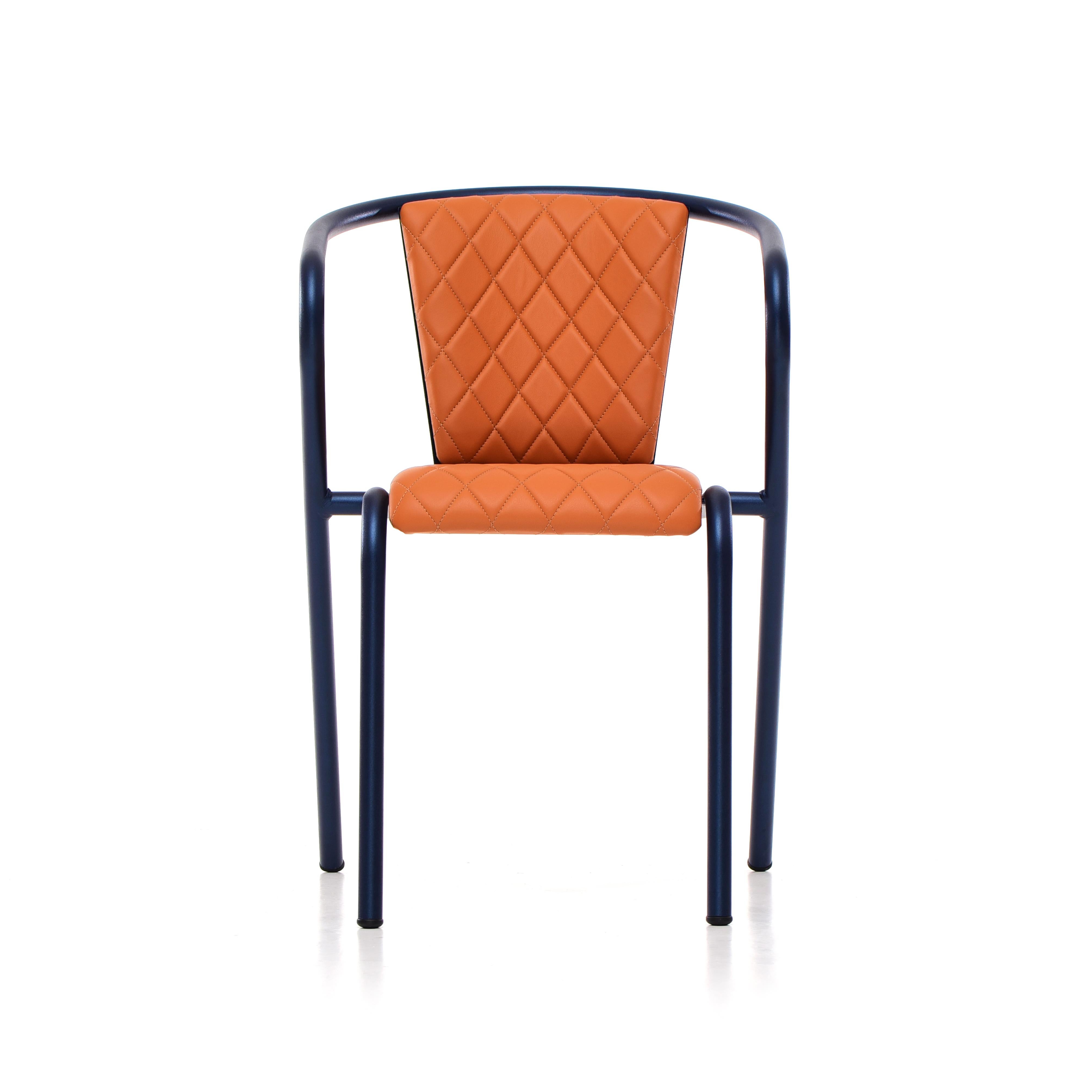 The BICA chair is a comfortable stackable steel dining armchair made from recycled and recyclable steel, finished with our premium selection of powder-coating colors, in this case in a texturized Deep Blue, that transform a classic in something new