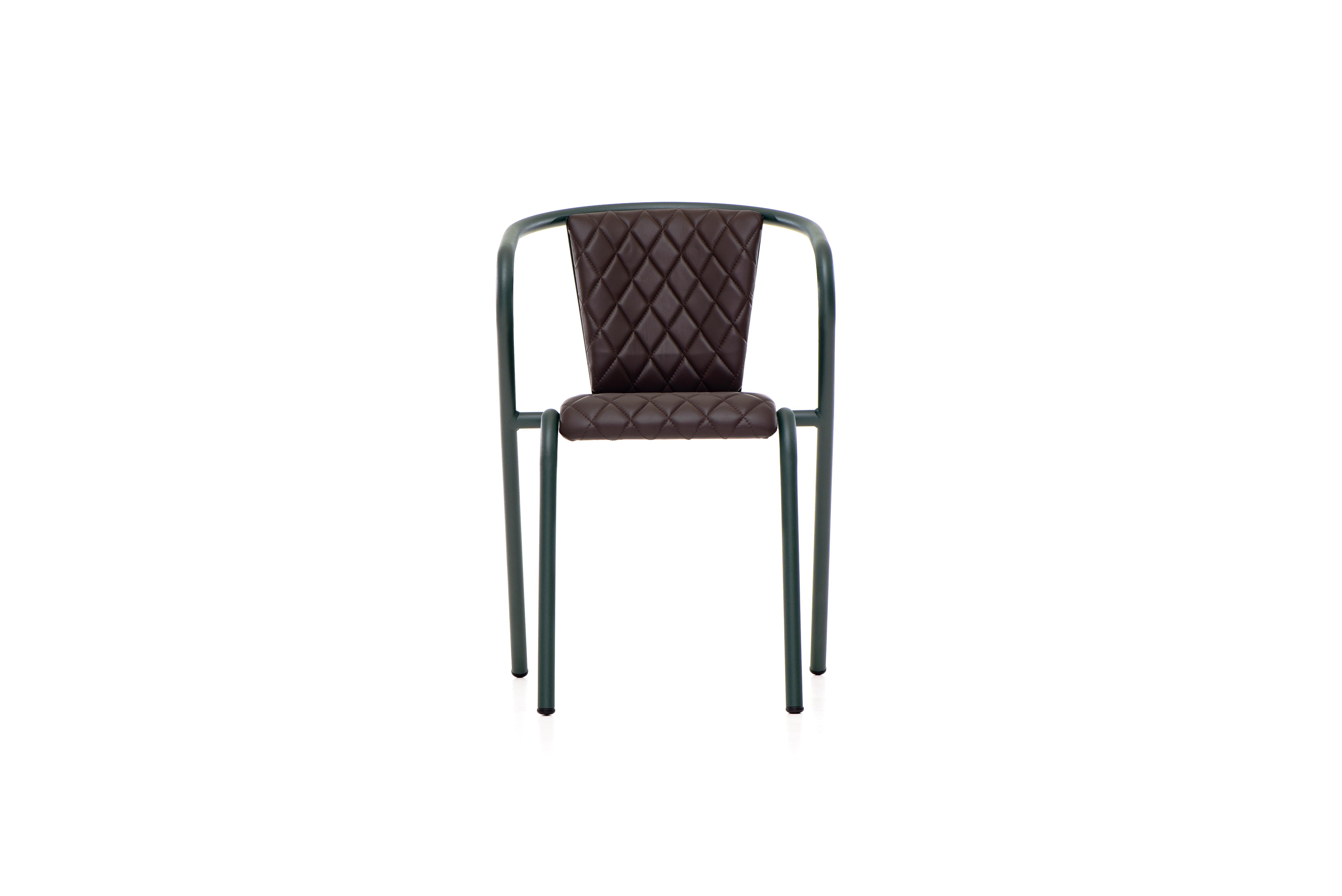 The BICA chair is a comfortable stackable dining armchair made from recycled and recyclable steel, finished with our premium selection of powder-coating colors, in this case in a texturized Deep Green, that transform a classic in something new and