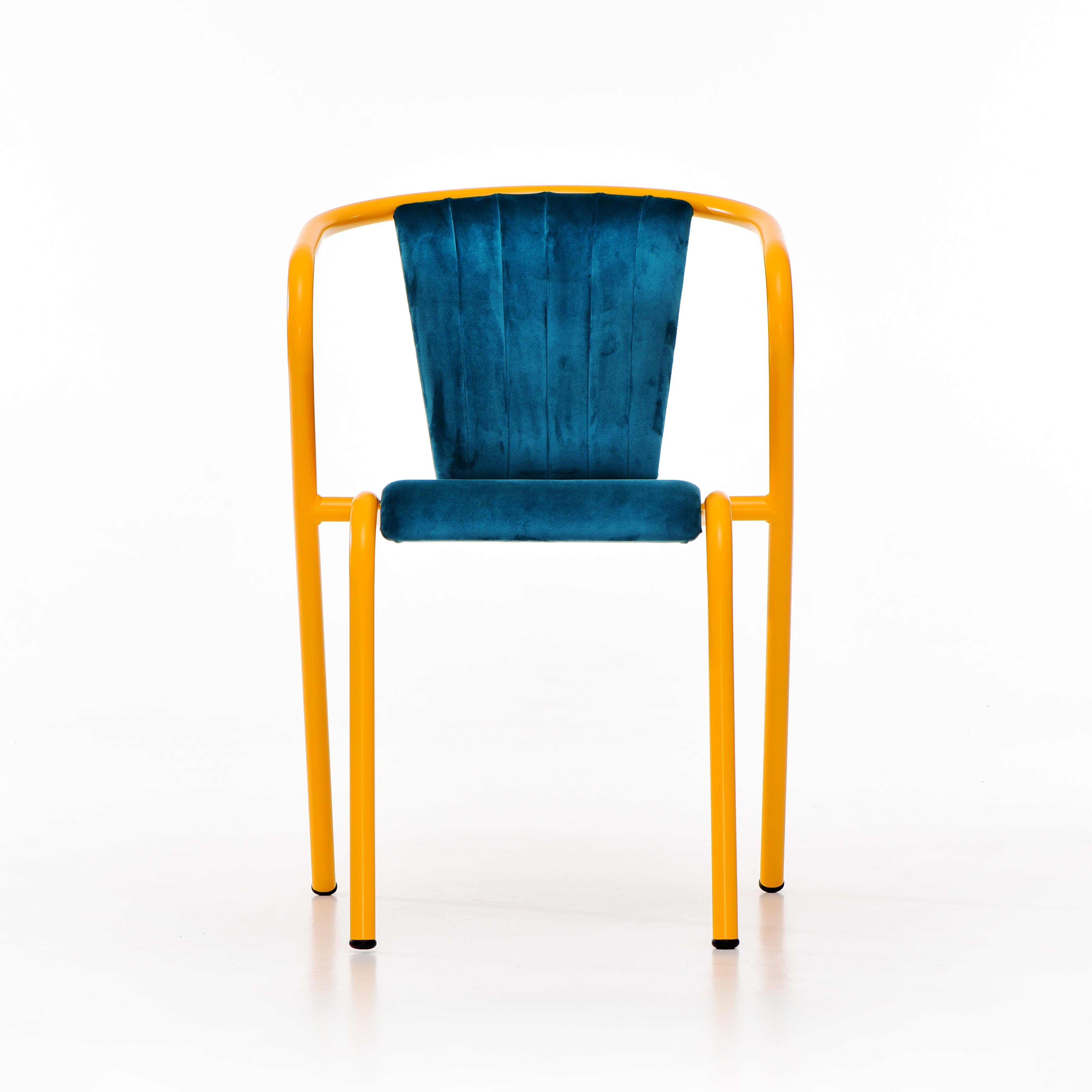 BICAchair is a stackable steel dining armchair made from recycled and recyclable steel, finished with our premium selection of powder-coating colors, in this case in a bright yellow color, that transforms a Classic in something new and vibrant. The