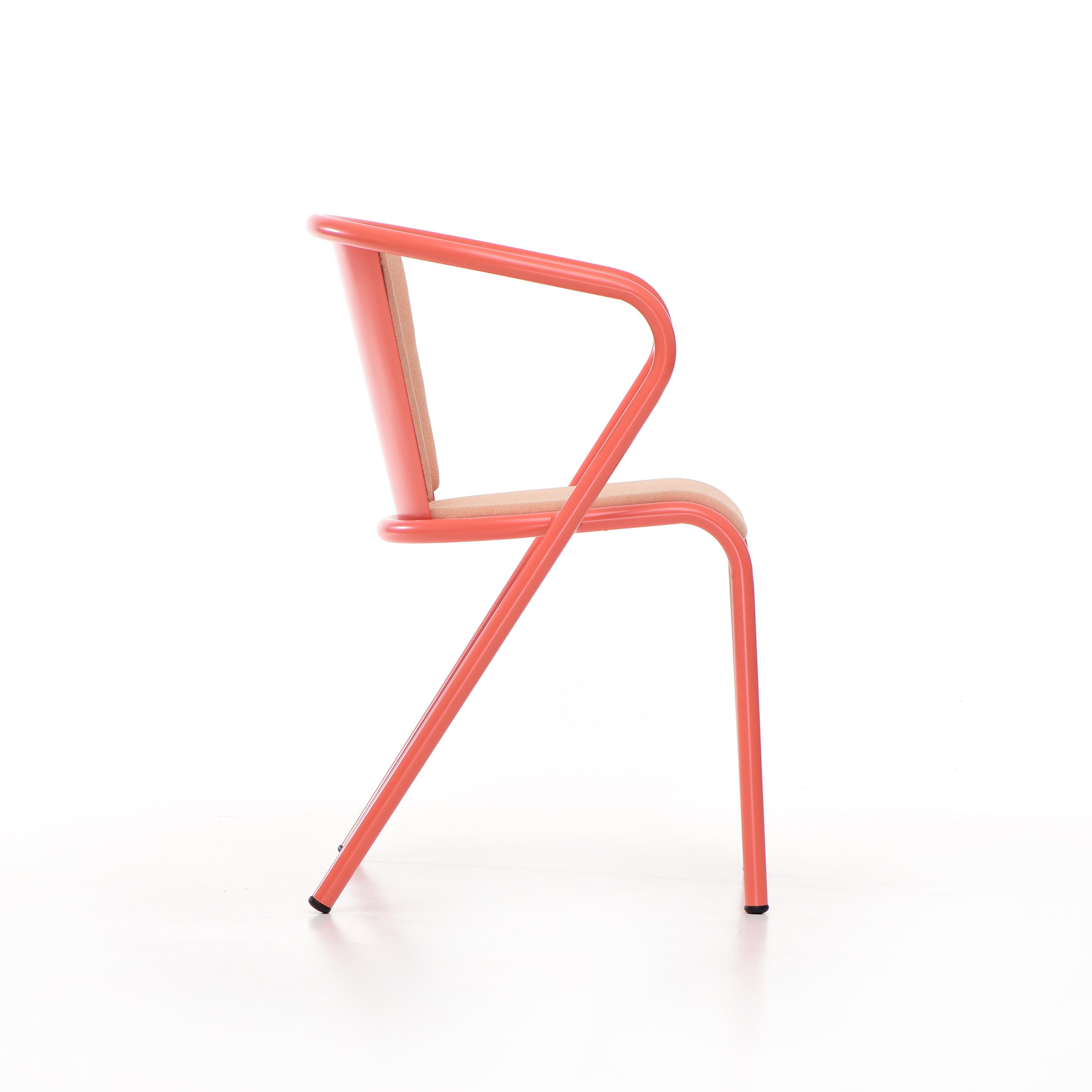 BICAchair is a sustainable stackable steel dining armchair made from recycled and recyclable steel, finished with our premium selection of powder-coating colors, in this case in a Pastel Reddish Pink color, that transforms a Classic in something new