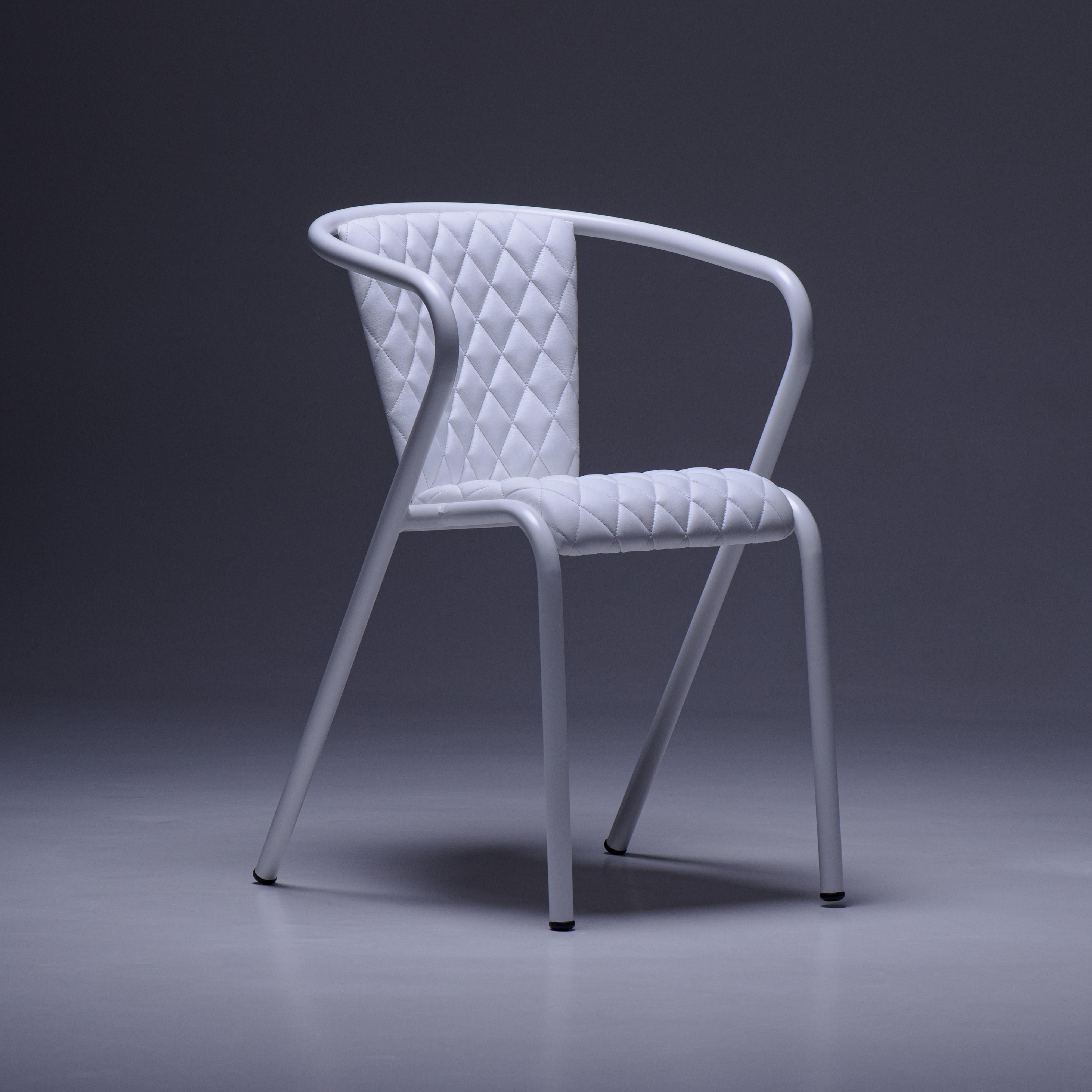 The BICAchair is a comfortable stackable steel dining armchair made from recycled and recyclable steel, finished with our premium selection of powder-coating colors, in this case in White, that transform a classic into something new and vibrant. The