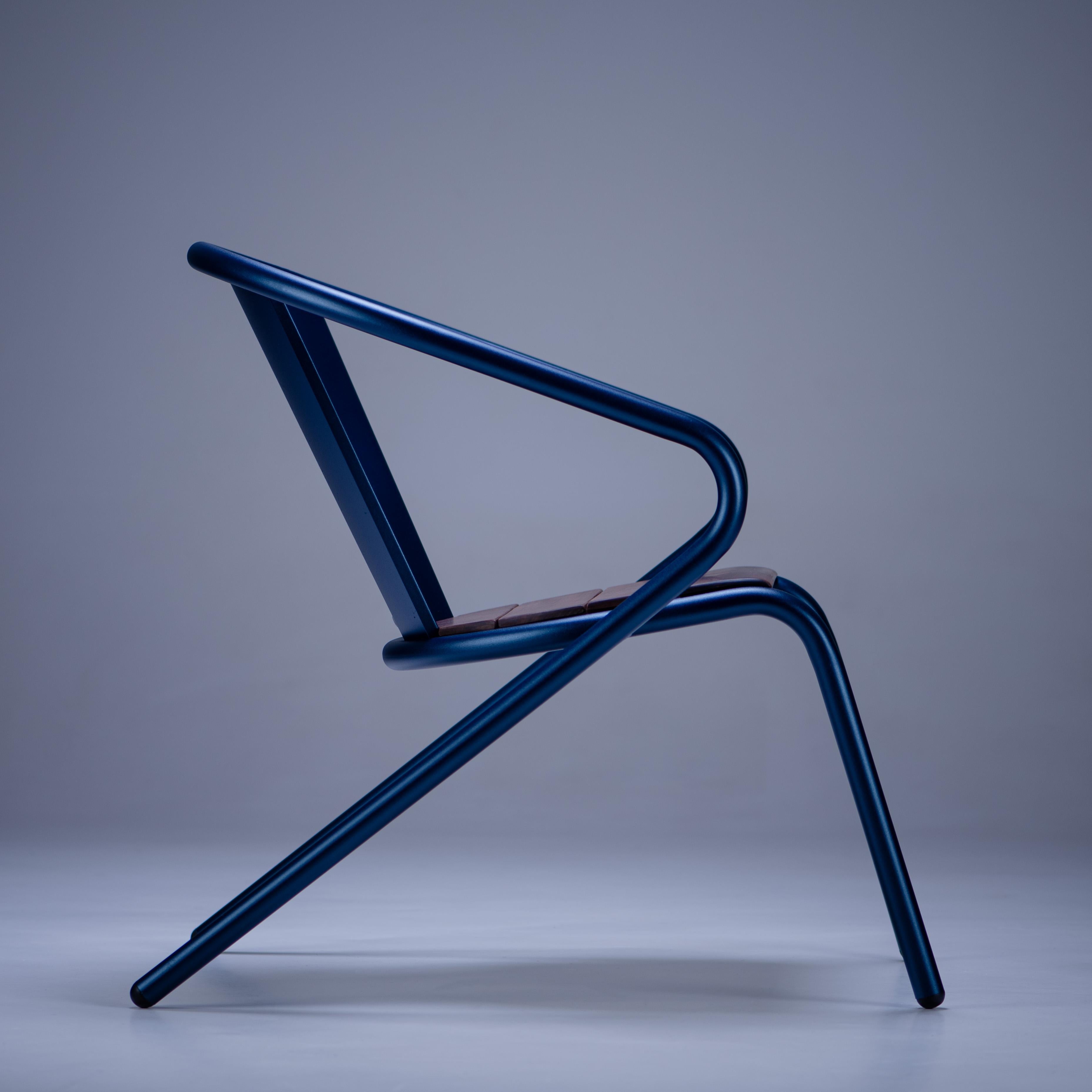 BICAlounge is a sustainable stackable steel Lounge Chair made for the outdoors from recycled and recyclable steel and finished with our premium selection of powder-coating colors, in this case in a rich textured blue color, that transforms a Classic