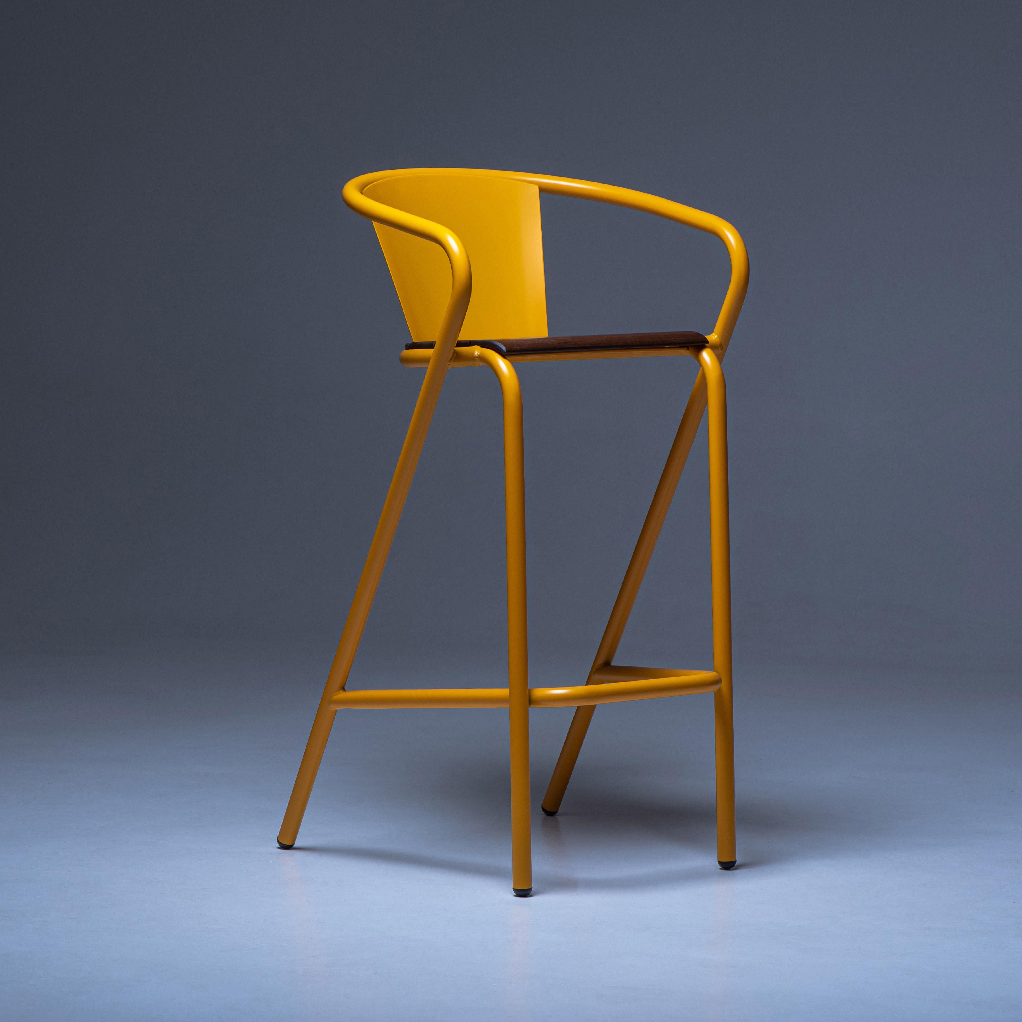 BICAstool is a sustainable stackable steel high stool chair made for the outdoors from recycled and recyclable steel and finished with our premium selection of powder-coating colors, in this case in a bright yellow color, that transforms a Classic