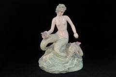 Bicauda Mermaid with Shell on Rock and Mythological Fish
