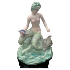 Vintage Bicauda Mermaid with Shell on Rock and Mythological Fish