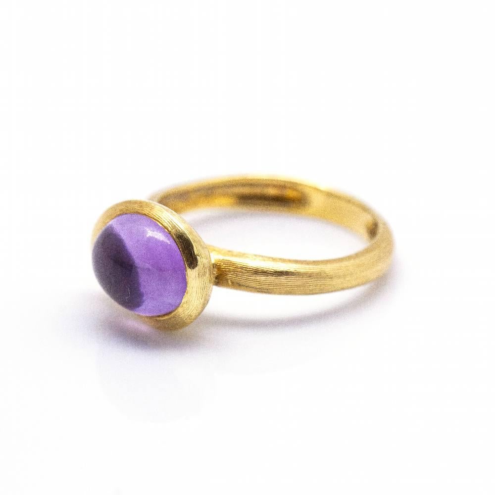 Italian designer Marco Bicego ring in Yellow Gold and Amethyst for women l 1x Amethyst cabochon cut 10mm approx. l Size 10  18kt Yellow Gold  4.10 grams  Brand new product  Ref.:D360360CS