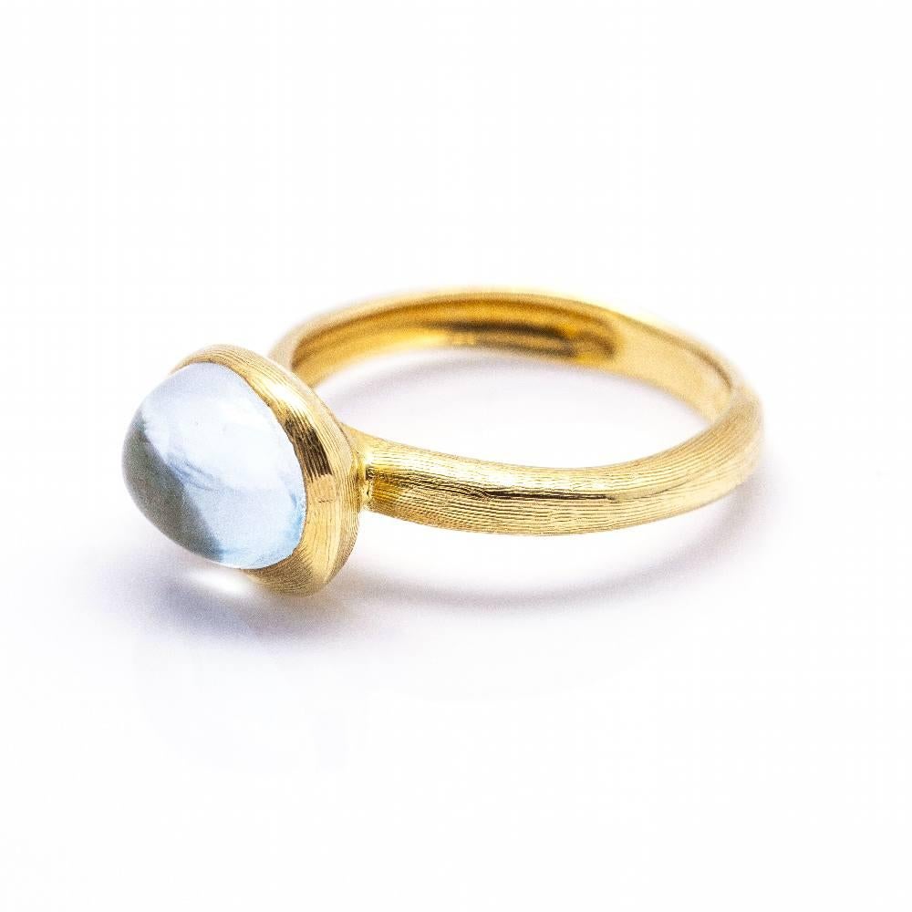 Italian designer Marco Bicego ring in Yellow Gold and Topaz for women l 1x Blue Topaz in cabochon cut approx. 10mm l Size 10  18kt Yellow Gold  4.10 grams  Brand new product  Ref.:D360361CS