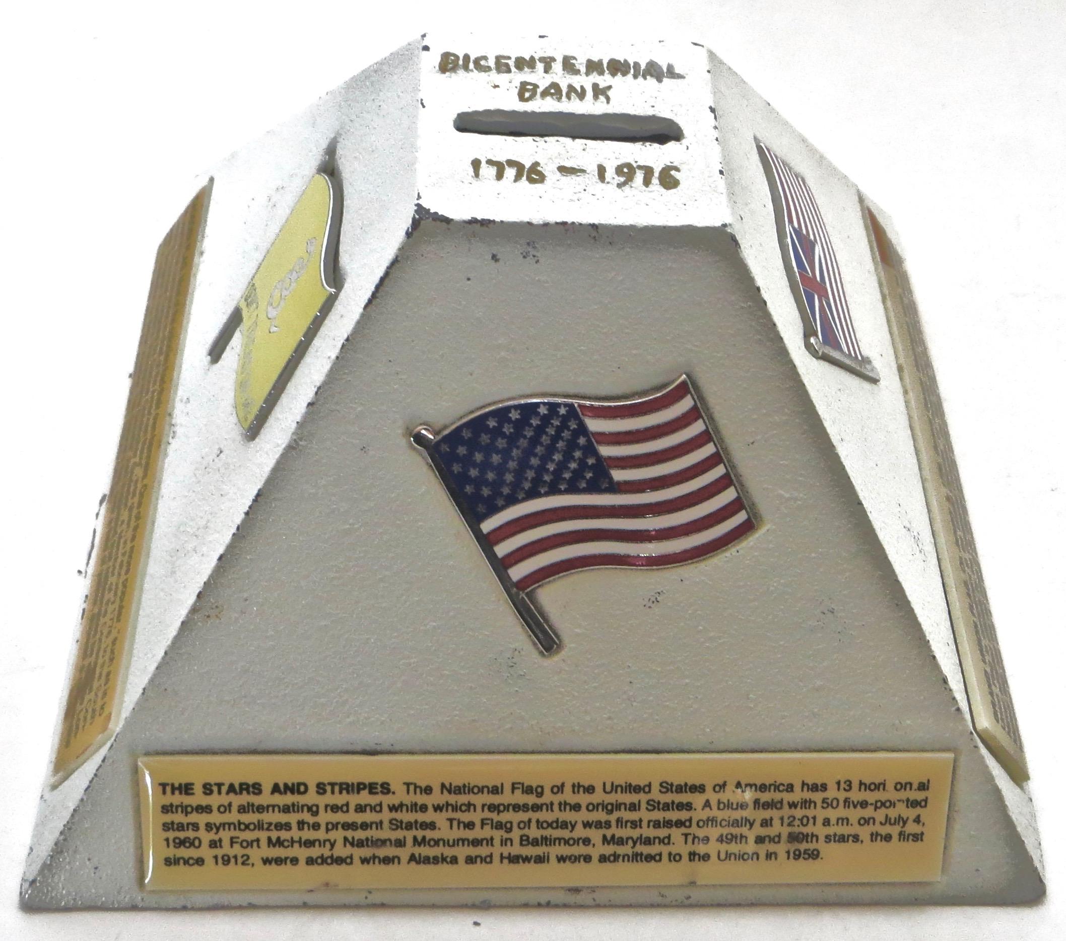 Shaped like a pyramid this cast iron penny bank was made to commemorate the 200 year anniversary of America; thus inscribed at the top (see image) 1776-1976. It is painted in white (all original) and in excellent condition, with the four original,