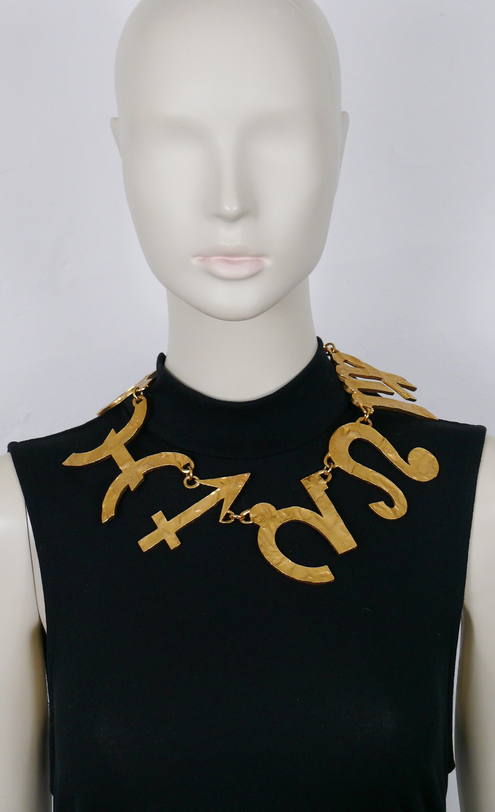 BICHE DE BERE vintage massive limited edition gold tone necklace featuring 6 hammered zodiac symbols.

Hook closure.

Embossed BICHE DE BERE.
Numbered 28/147.

Indicative measurements : length approx. 46.5 cm (18.31 inches) / max. width approx. 6.5