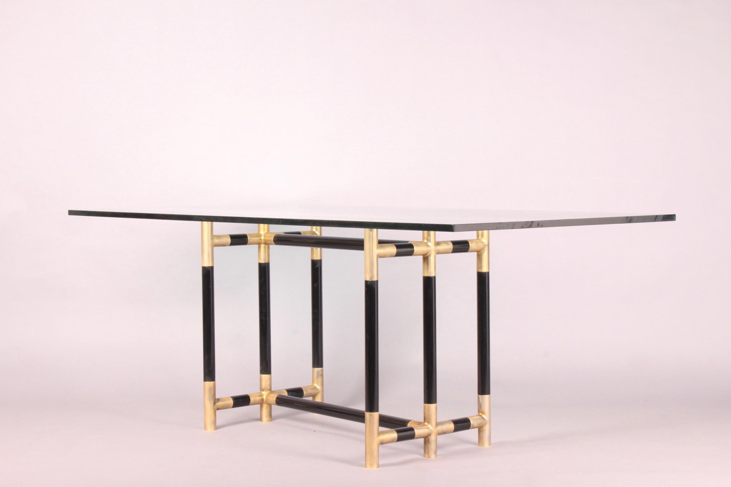 Bicolor brass and glass dinning table, dimensions with out glass top H 71 by 85 by 50 cm.