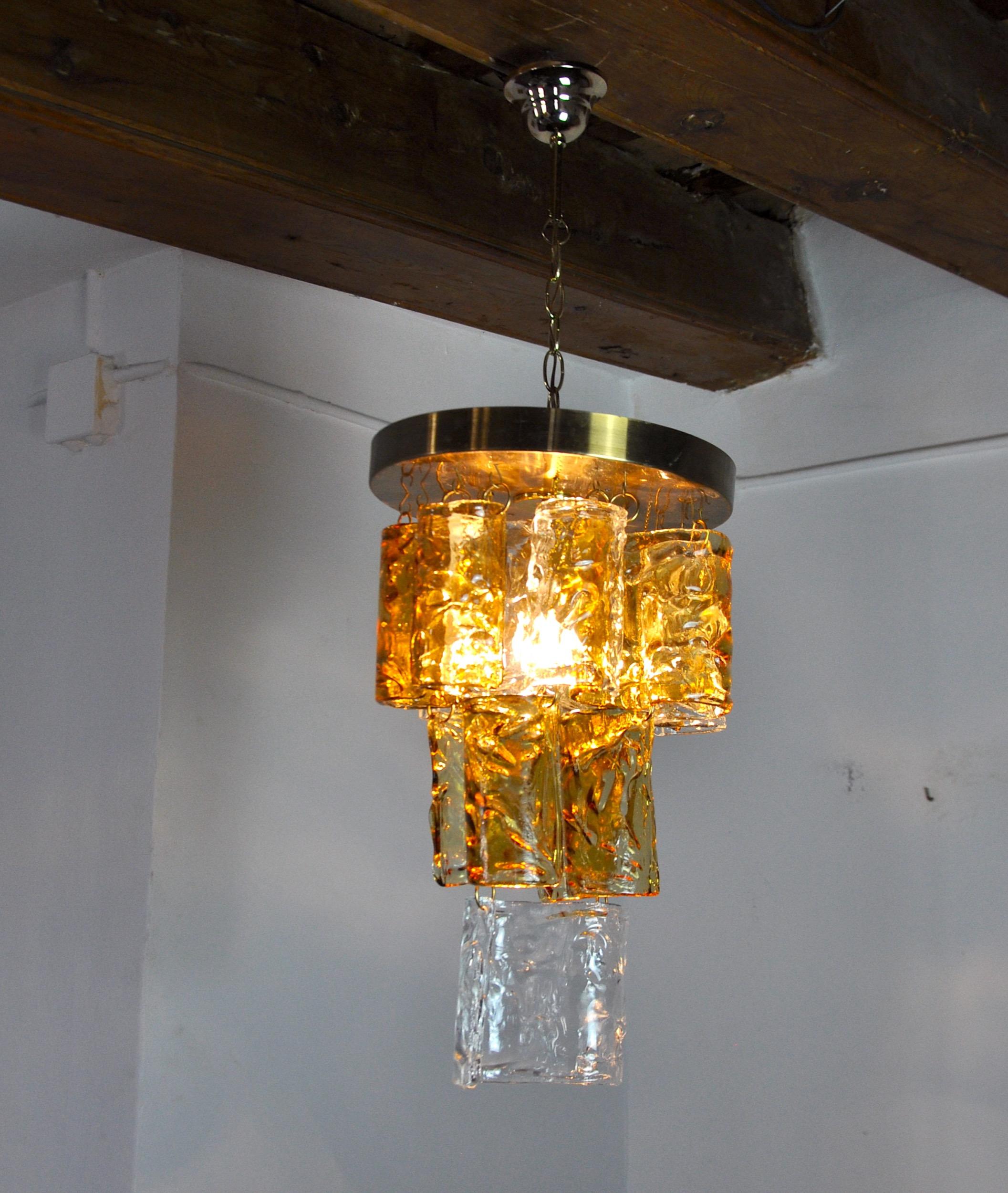 Superb and rare waterfall chandelier designed and produced by zero quattro in the 70s in murano, italy. Golden structure and orange curved crystals spread over 3 levels in perfect condition. Rare design object that will illuminate your interior