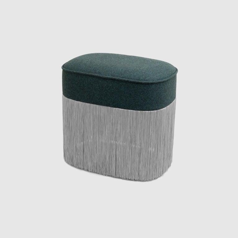 Galata ottoman by Edvin Klasson,
2017
Dimensions: H 45 x W 45 x D 30 cm
Materials: Upholstery, pine, polyester fringes

The ottoman was originally conceived in Turkey, and introduced to Europe in the
late 18th century. Galata is a small