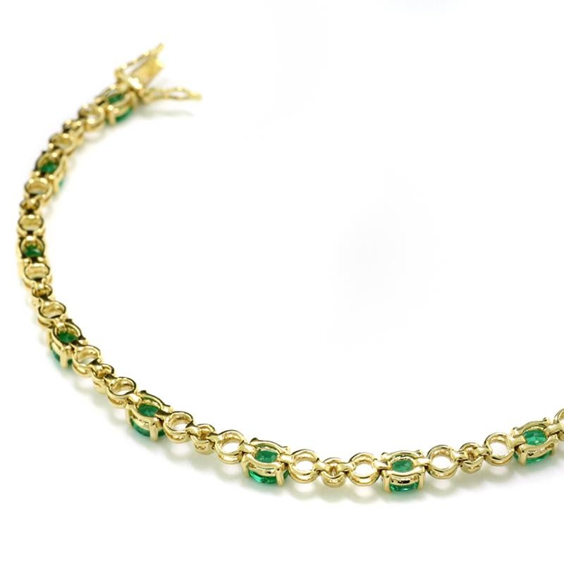 Contemporary Bicolor Line Bracelet Adorned with Emeralds and Diamonds in 18Kt Yellow Gold For Sale