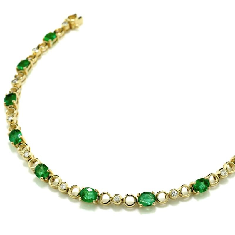 Oval Cut Bicolor Line Bracelet Adorned with Emeralds and Diamonds in 18Kt Yellow Gold For Sale
