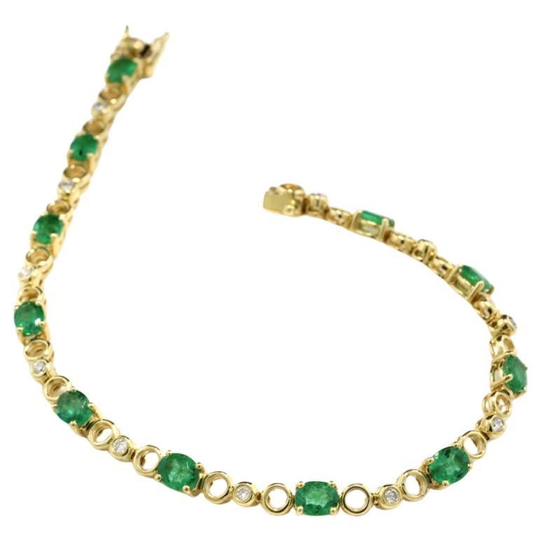 Bicolor Line Bracelet Adorned with Emeralds and Diamonds in 18Kt Yellow Gold For Sale