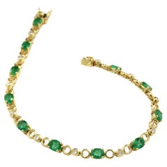 Bicolor Line Bracelet Adorned with Emeralds and Diamonds in 18Kt Yellow Gold