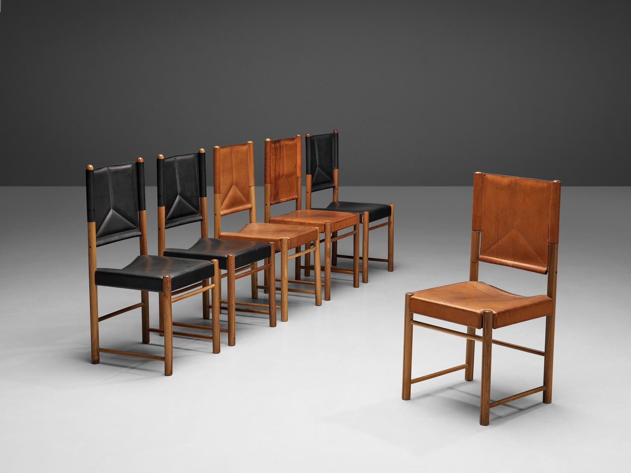 Set of dining chairs, leather, walnut, Italy, 1980s

This striking set of dining chairs surprises with a color range from black to cognac. Together the leather seats and backrests form an admirable set. The curved seat and the backrest with